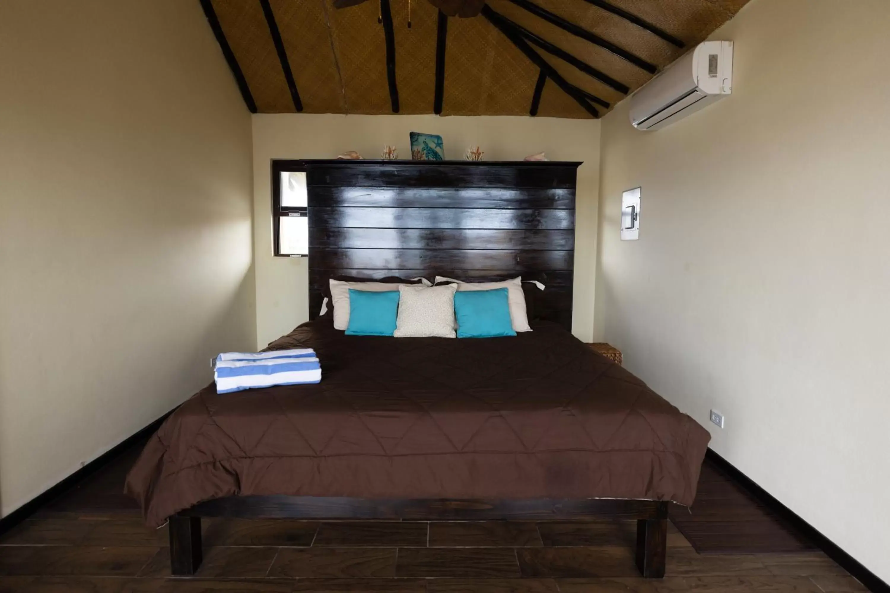 Bed in Lina Point Belize Overwater Resort