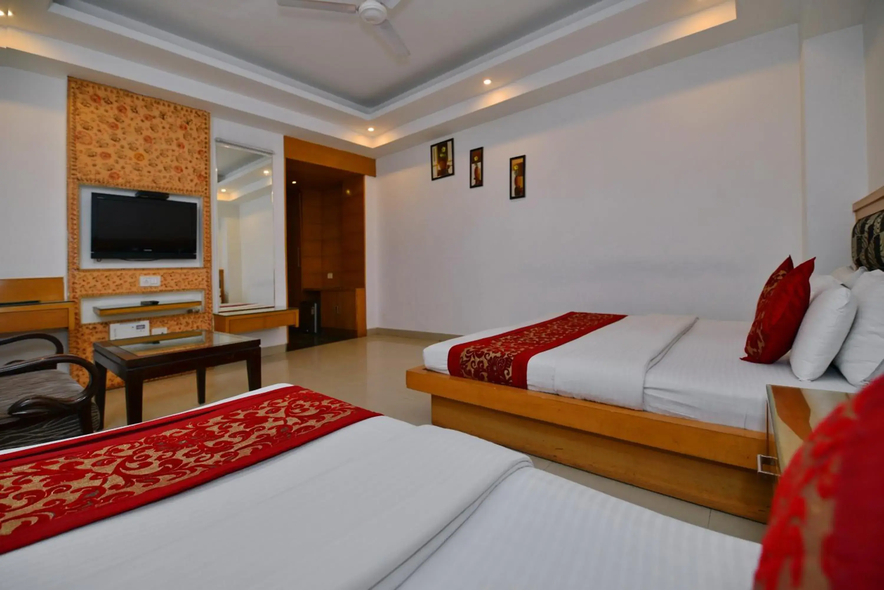 Communal lounge/ TV room, Bed in Hotel Krishna Deluxe-By RCG Hotels
