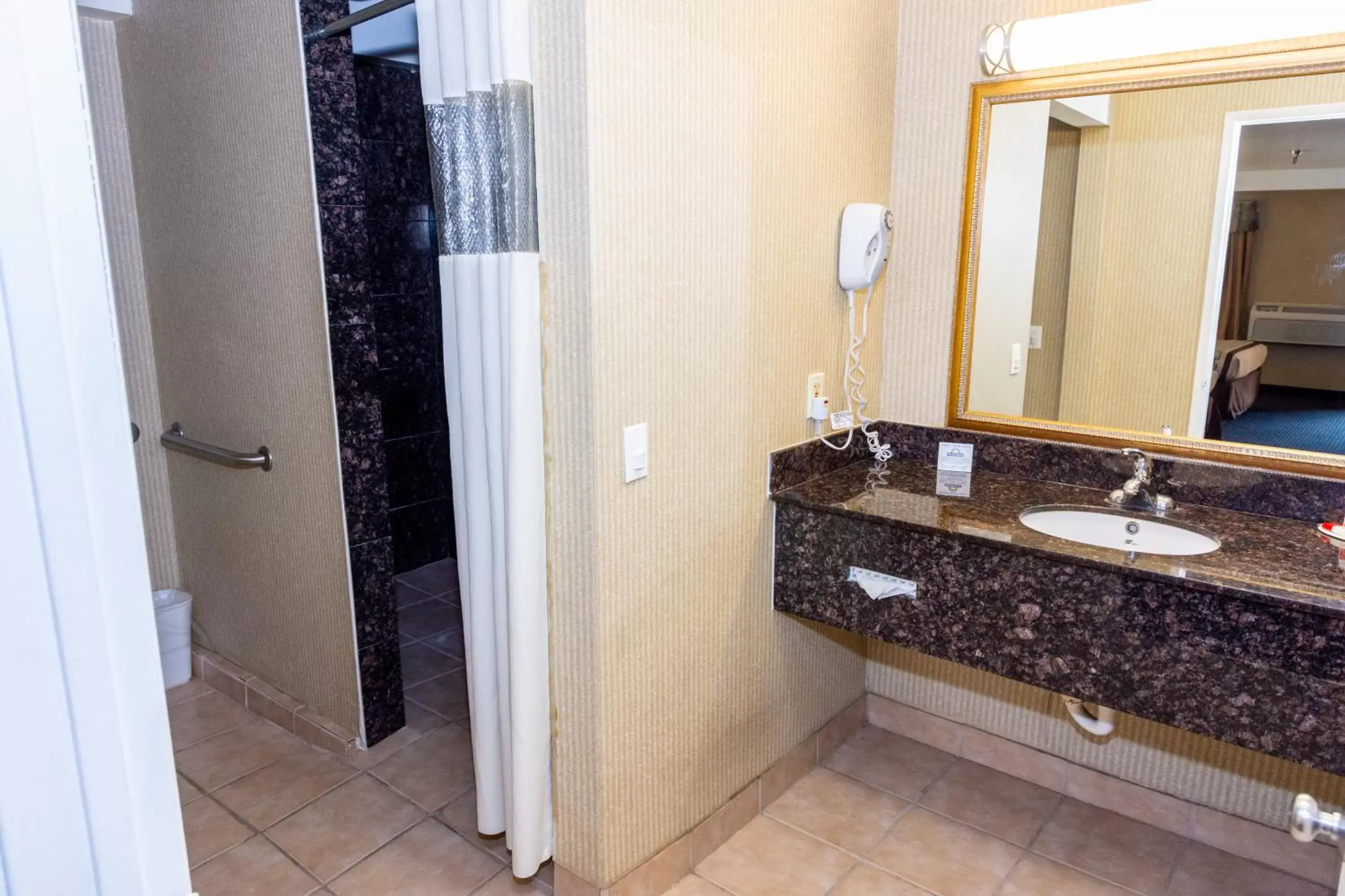 Bathroom in Days Inn & Suites by Wyndham Artesia