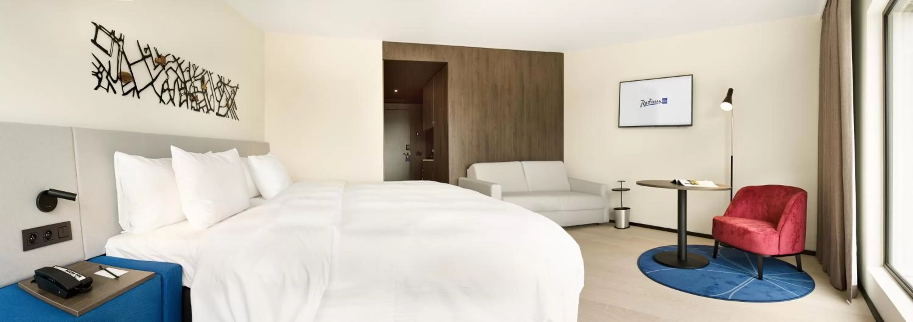 Photo of the whole room, Bed in Radisson Blu Hotel, Bruges