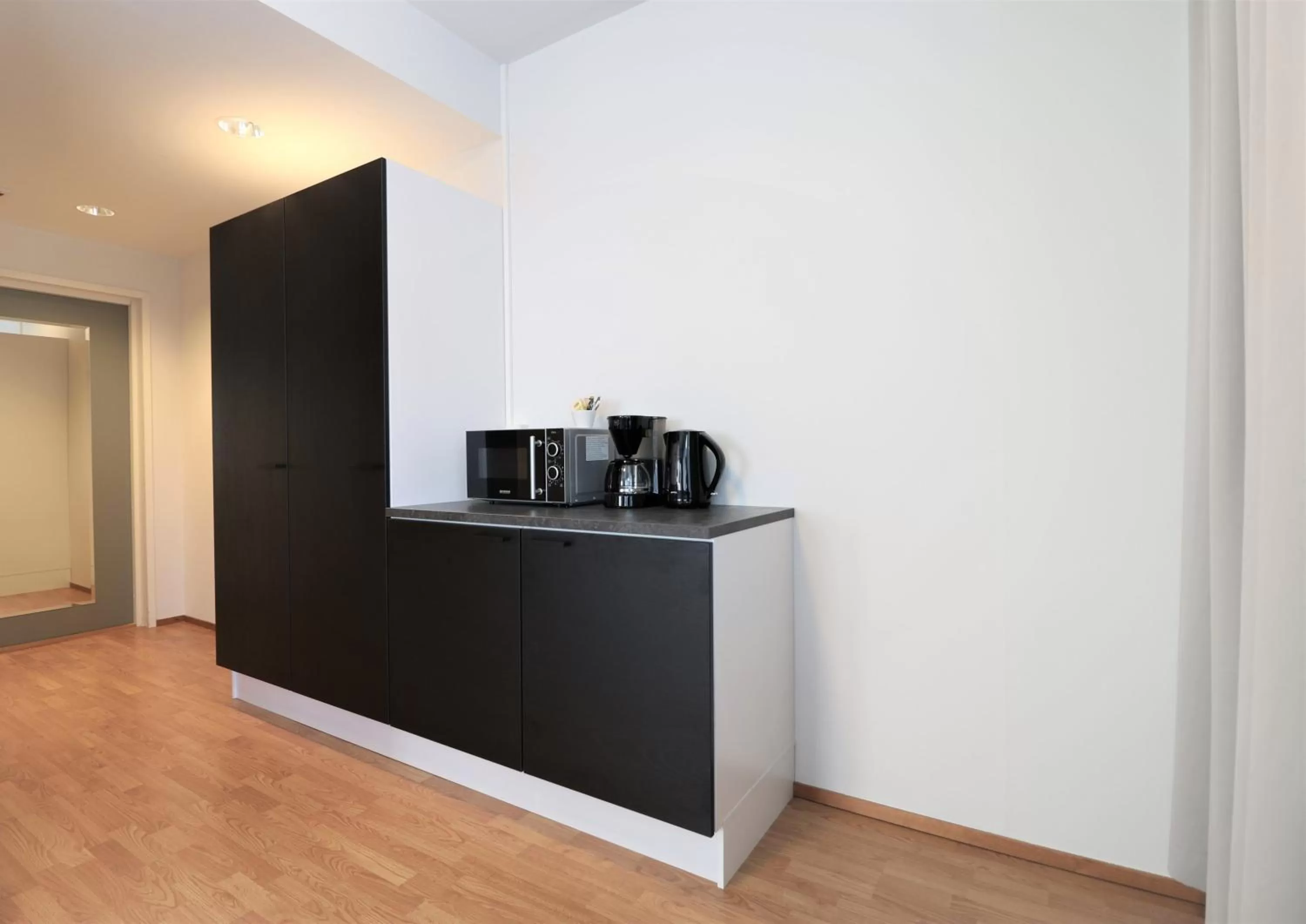 Kitchen or kitchenette in Forenom Aparthotel Helsinki Herttoniemi