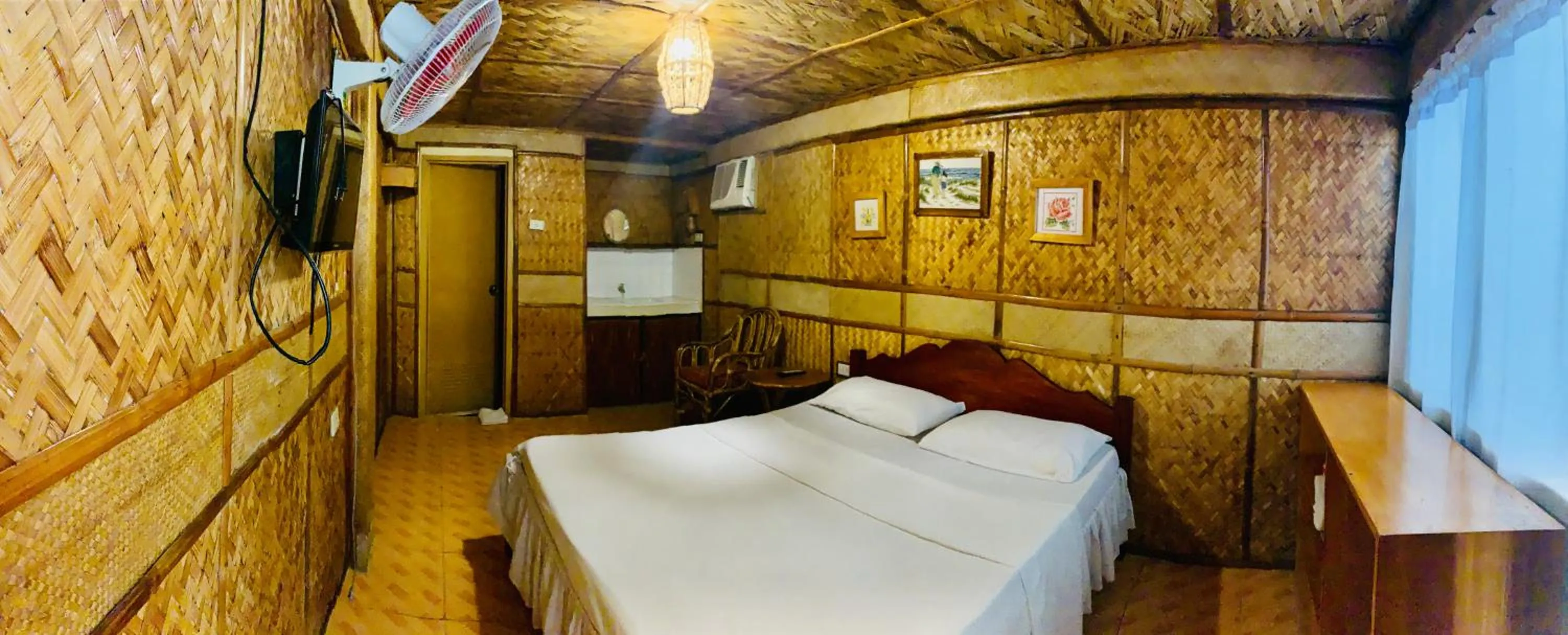 Bed in Bamboo House Beach Lodge & Restaurant