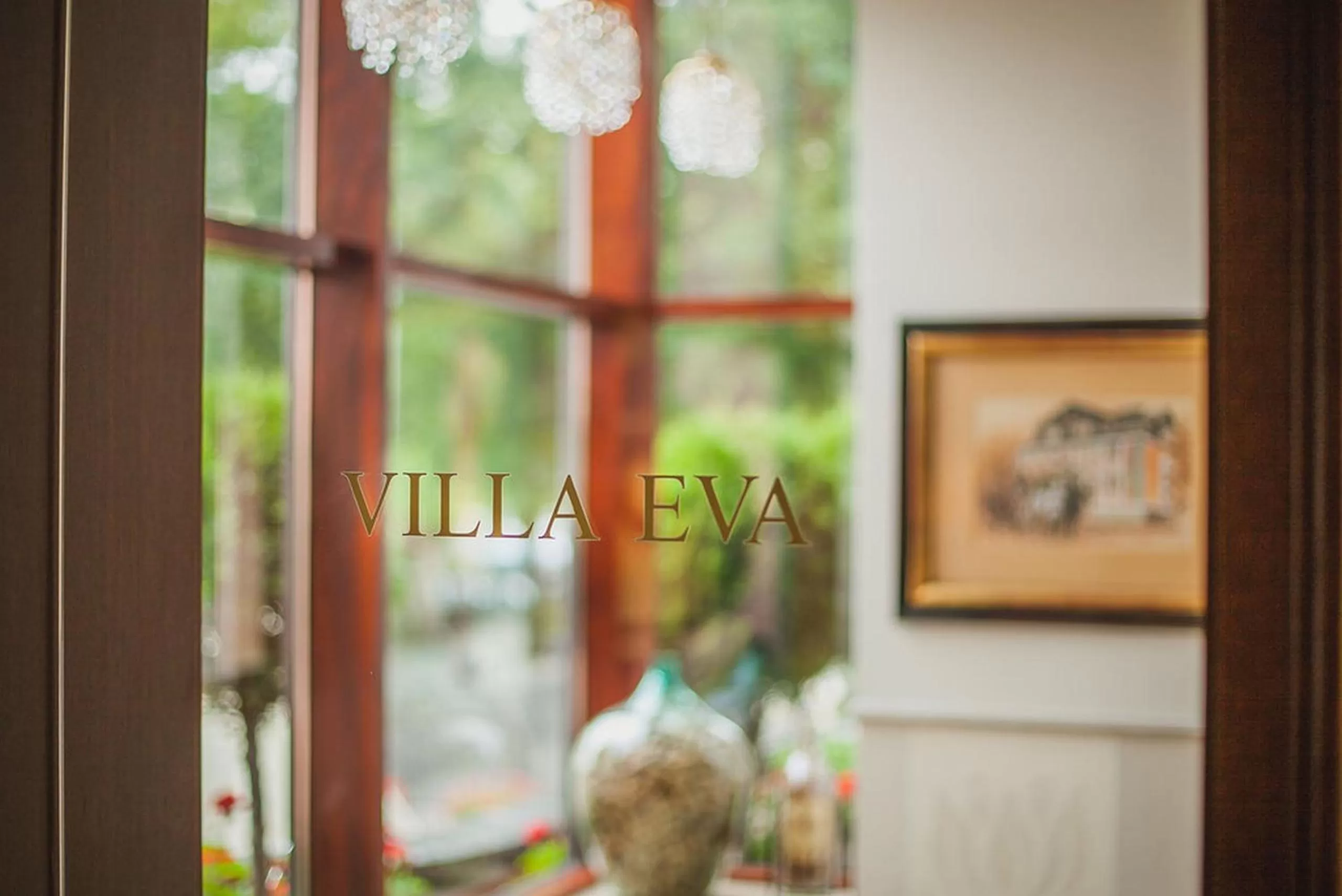 Property logo or sign in Hotel Villa Eva