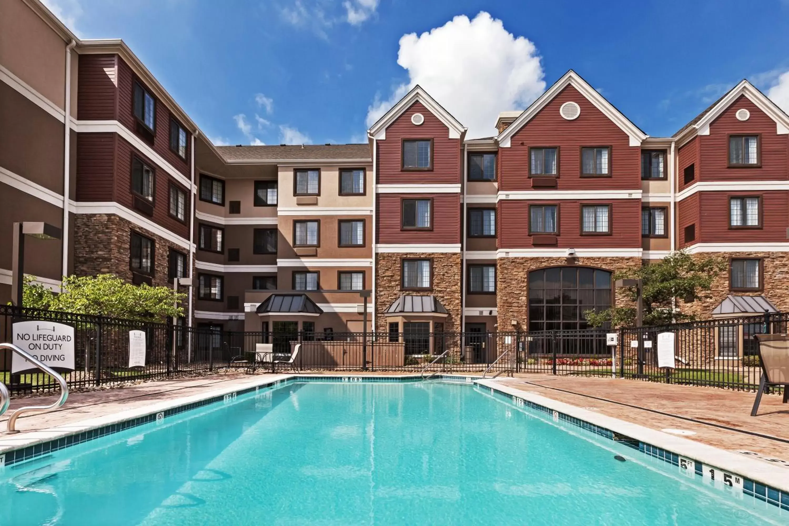 Swimming pool, Property Building in Staybridge Suites Tulsa-Woodland Hills, an IHG Hotel