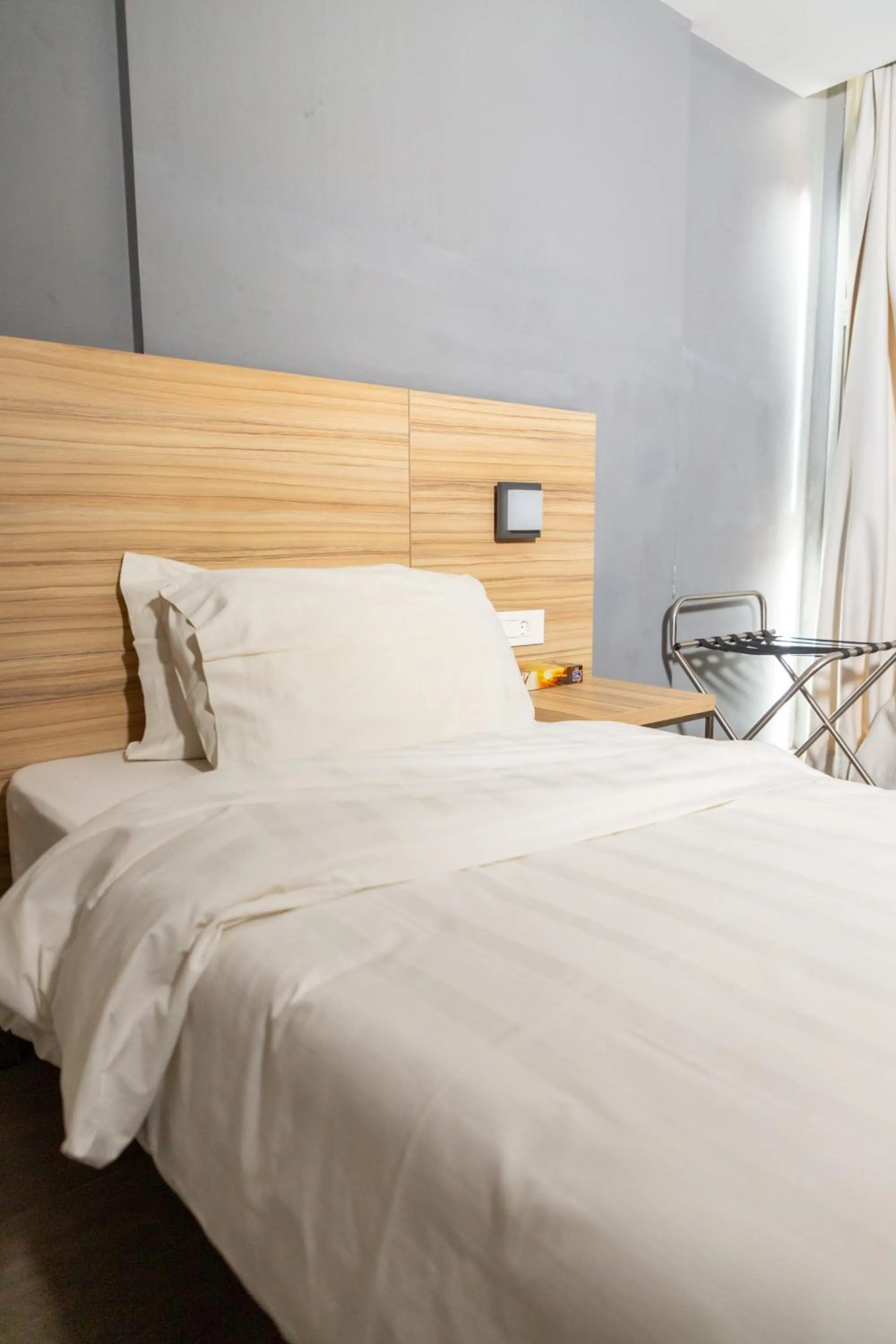 Bed in Caramel Boutique Hotel