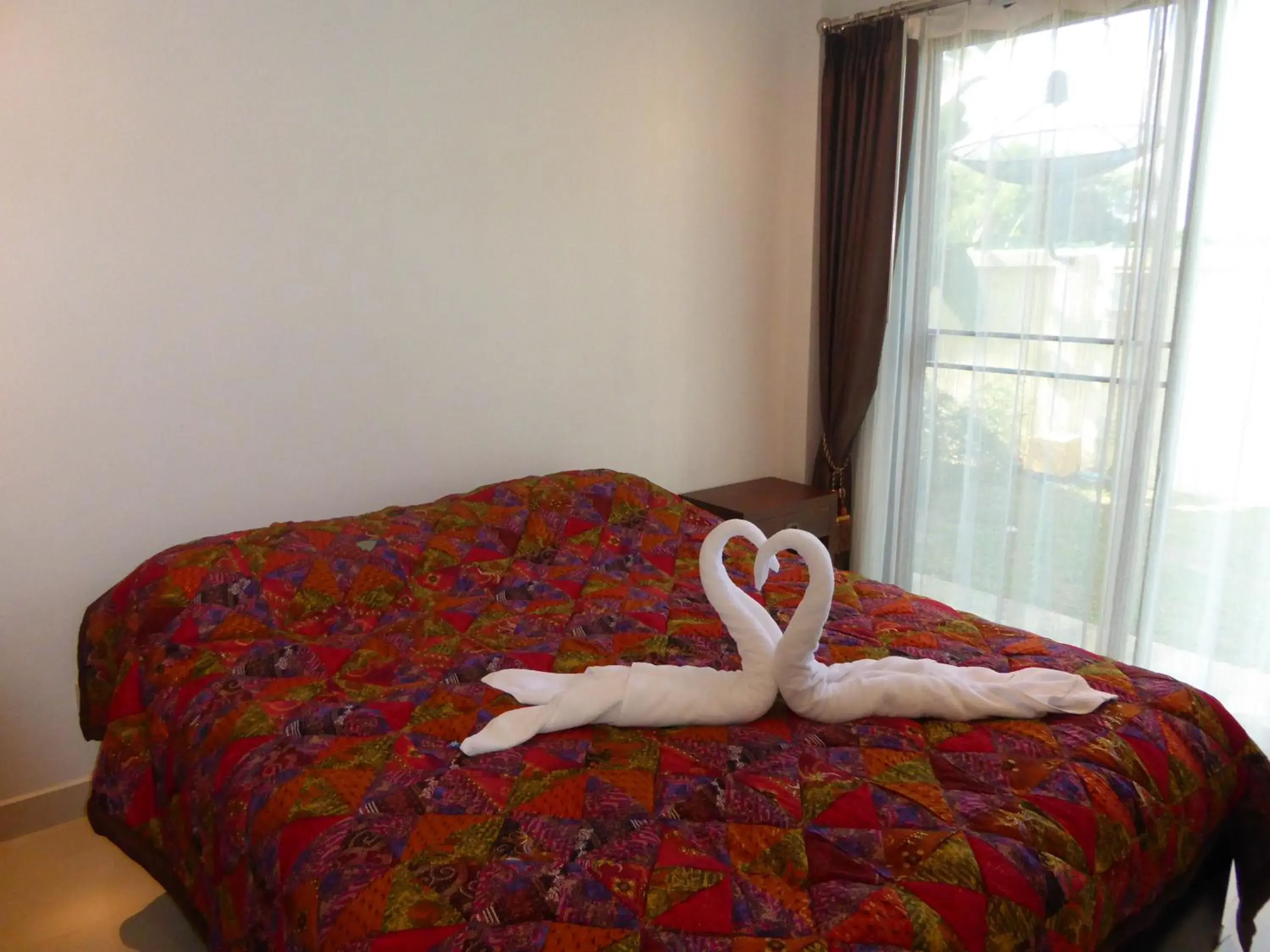Bed in Oasis Garden & Pool Villa at VIP Resort