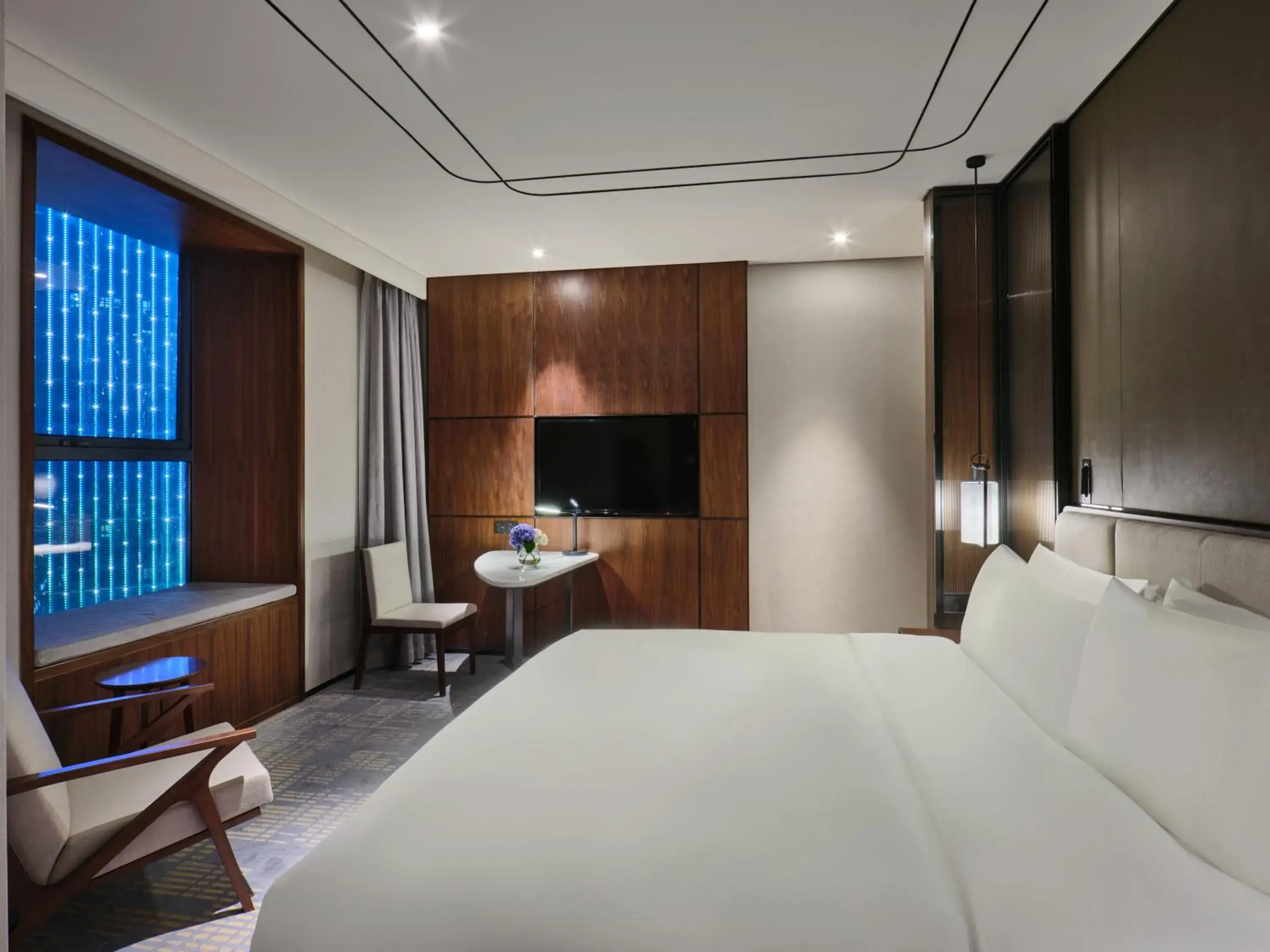 Bed in Crowne Plaza Wuhan Development Zone, an IHG Hotel