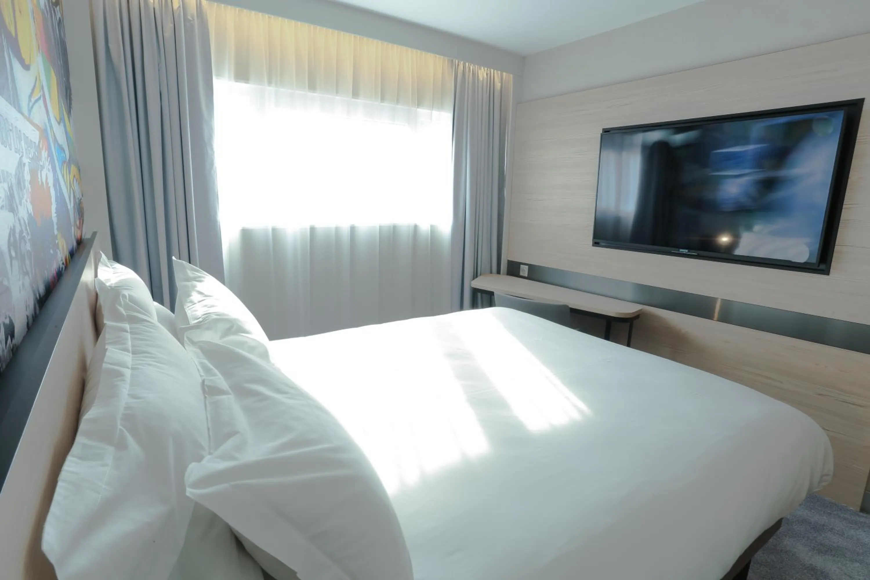 Bedroom in Arena Hotel La Defense