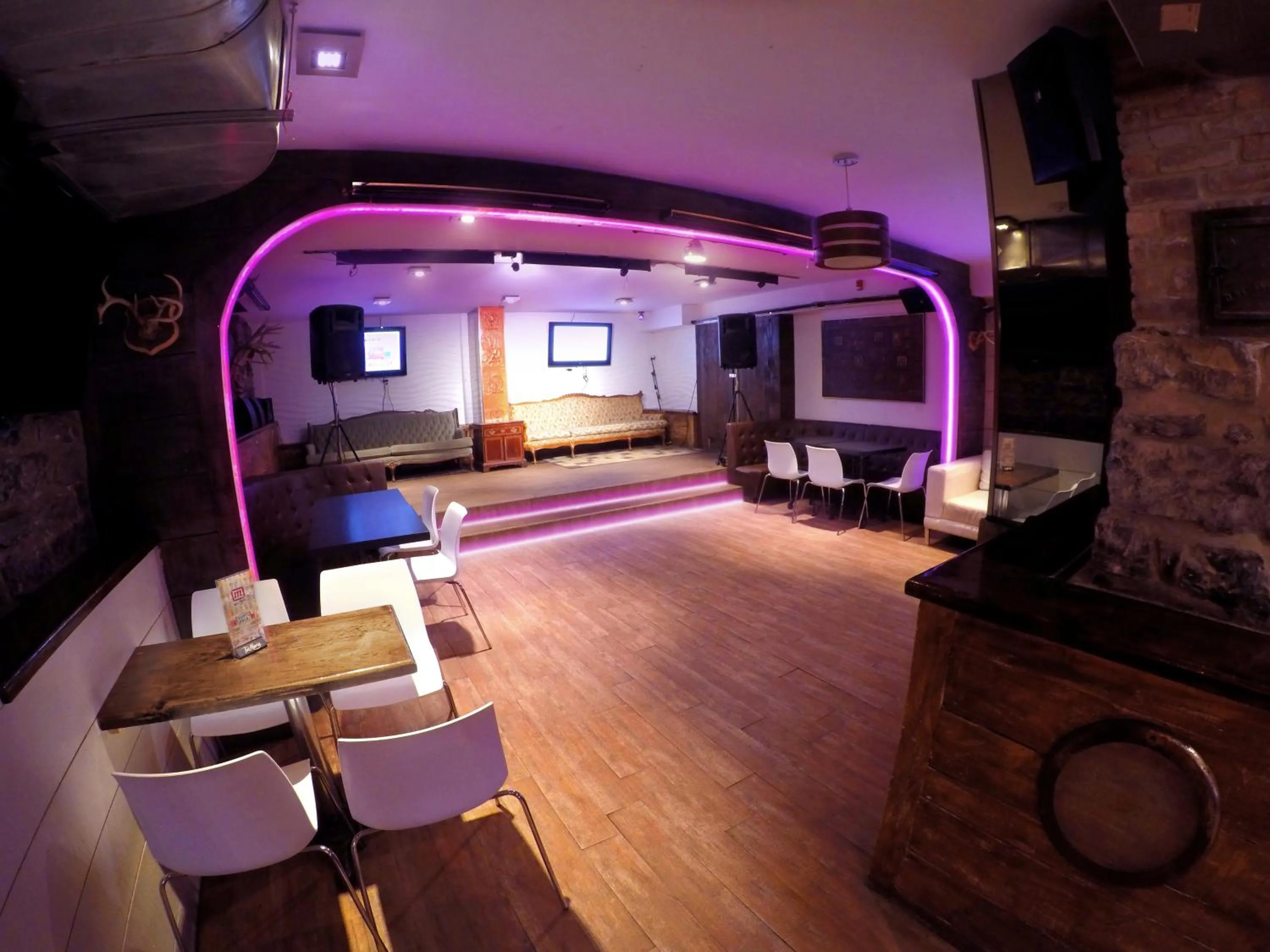 Communal lounge/ TV room in M Montreal Hostel