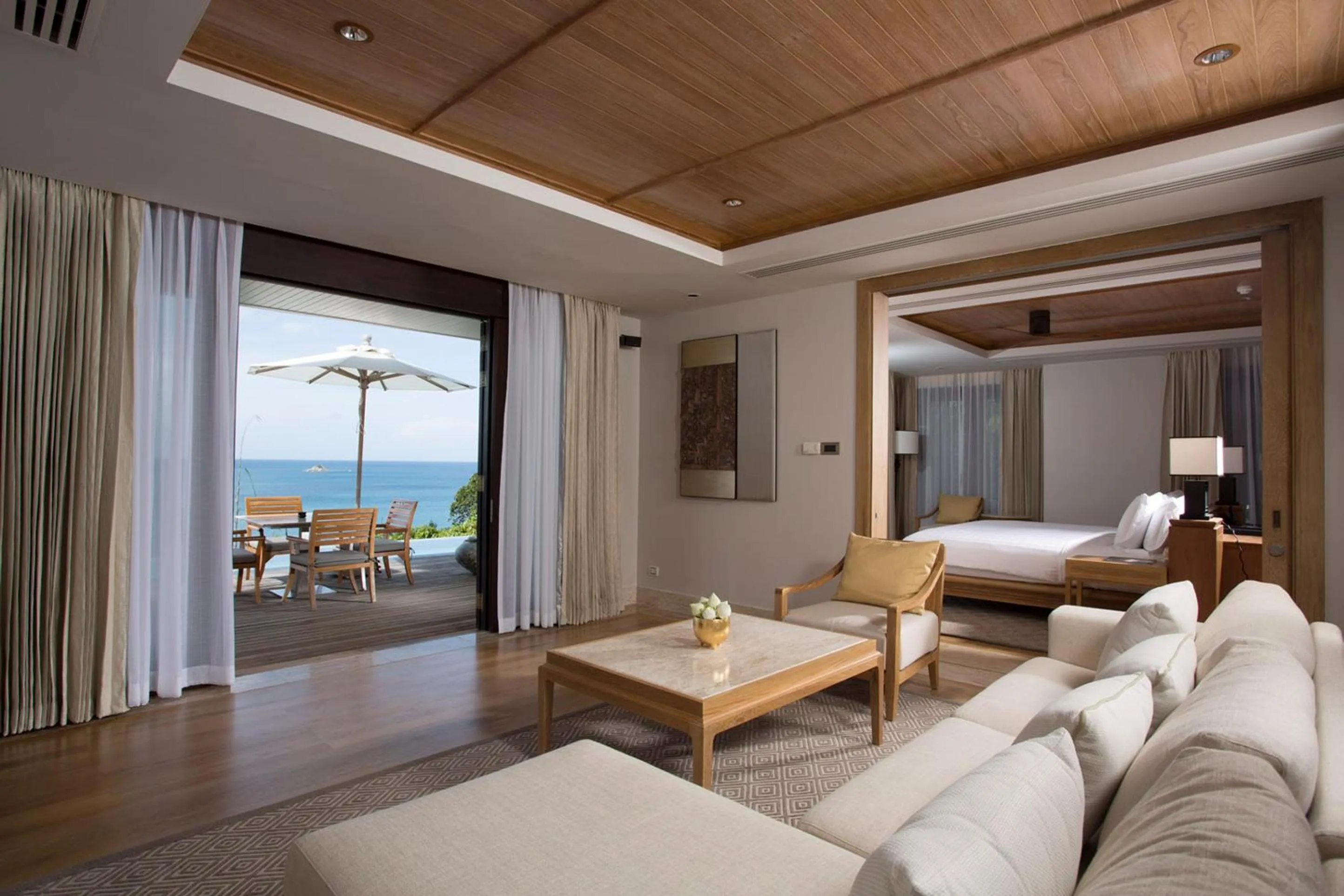 Living room, Bed in Trisara Villas & Residences Phuket