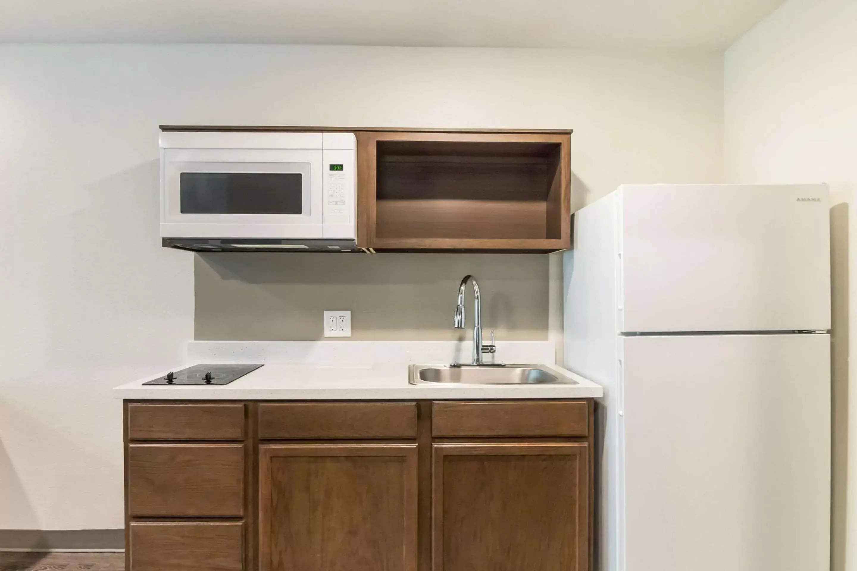 Photo of the whole room, Kitchen/Kitchenette in WoodSpring Suites Lake Jackson