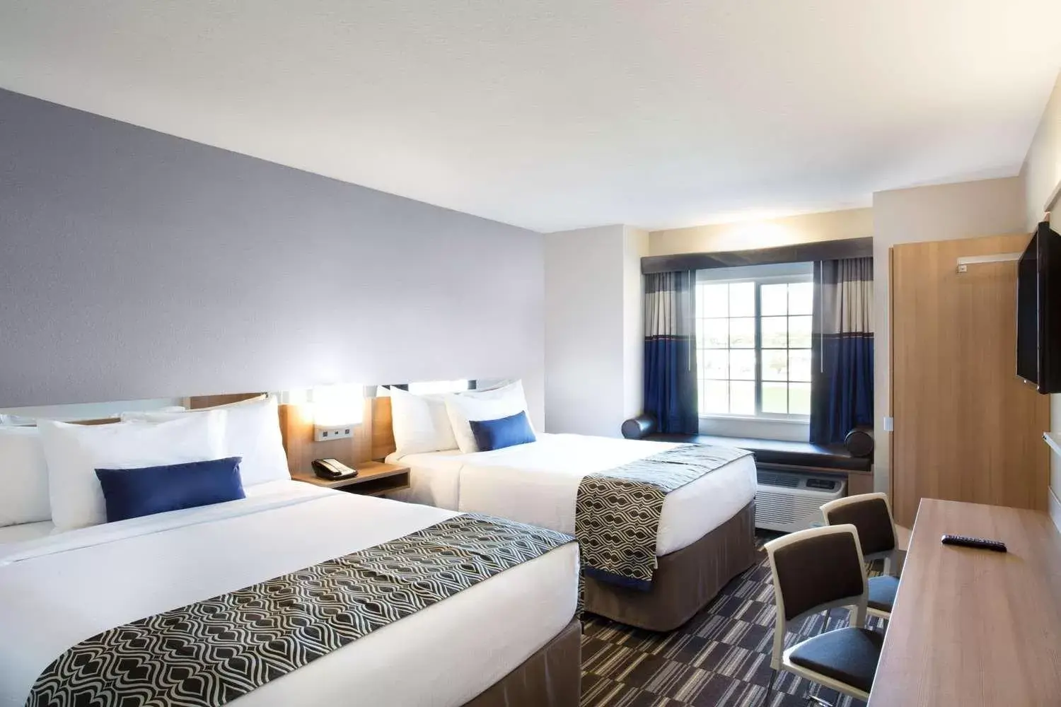 Bed in Microtel Inn & Suites by Wyndham Vernal/Naples