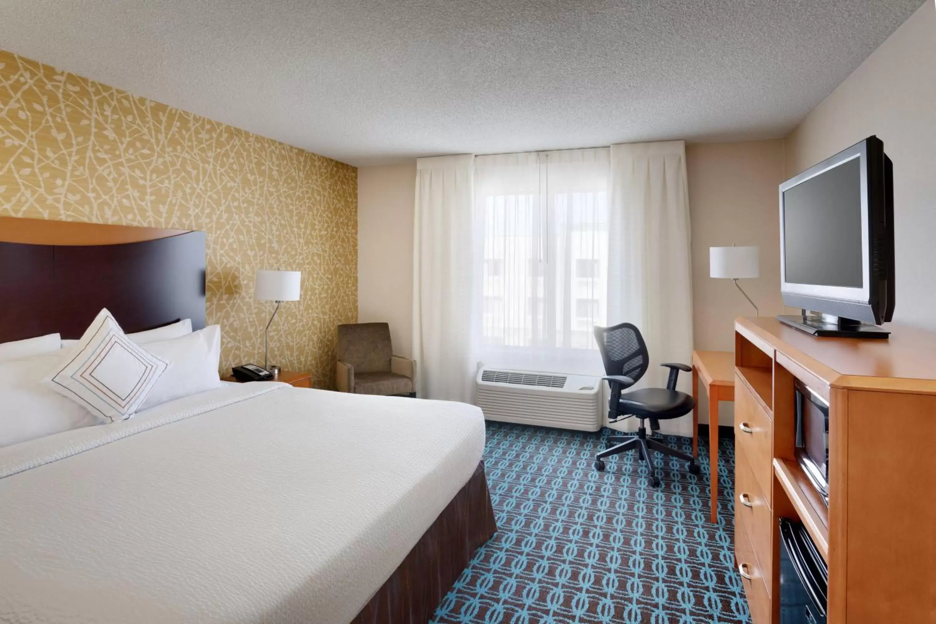 Photo of the whole room, TV/Entertainment Center in Fairfield Inn & Suites Salt Lake City Airport