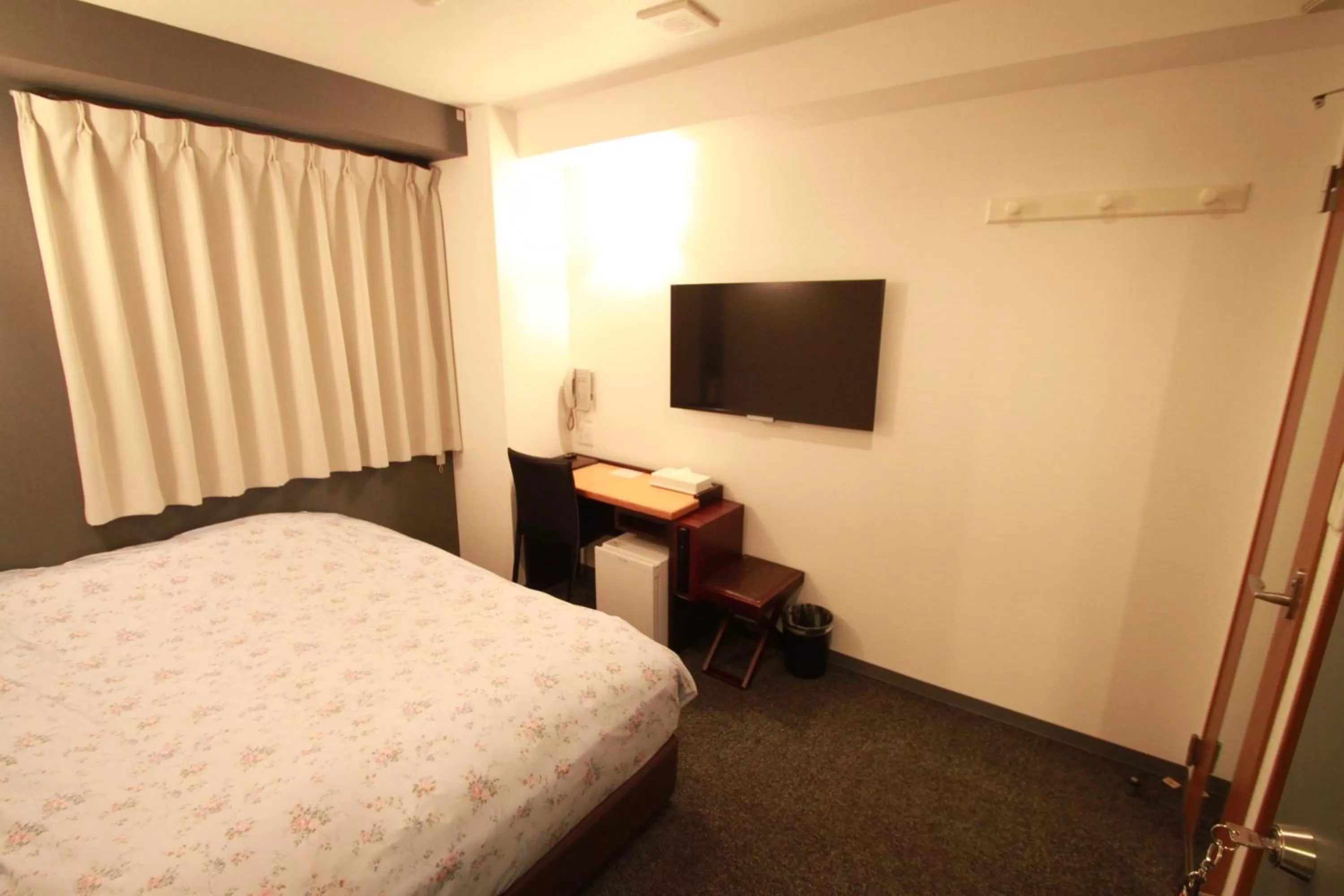 Bed in Toyama Town Hotel