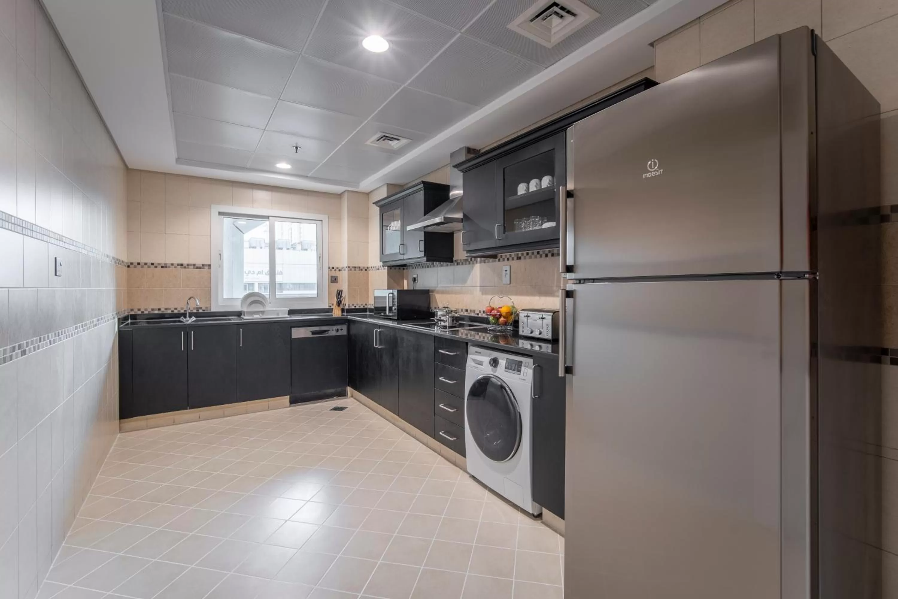 Kitchen or kitchenette in Rose Garden Hotel Apartments - Al Barsha, Near Metro Station