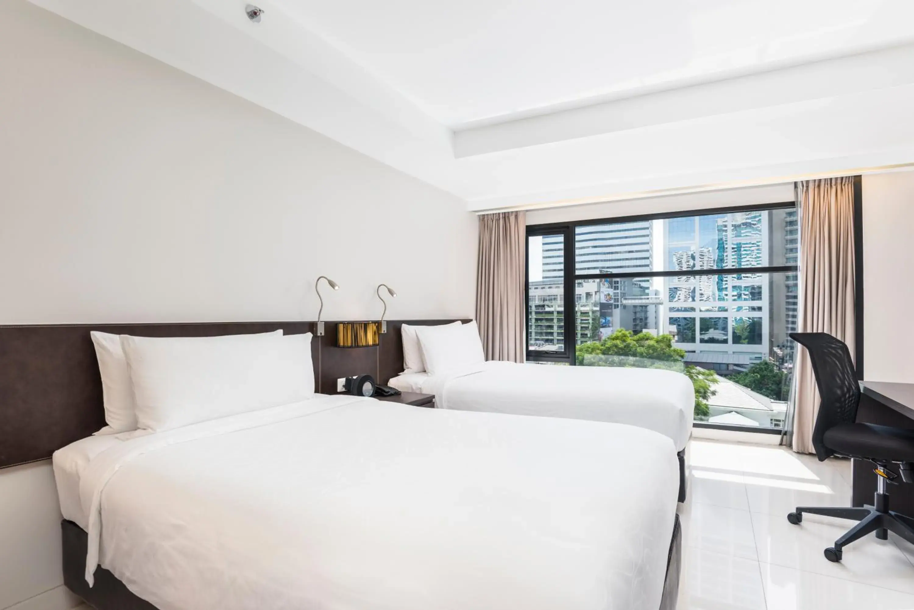 Bed in Maitria Hotel Sukhumvit 18 Bangkok – A Chatrium Collection