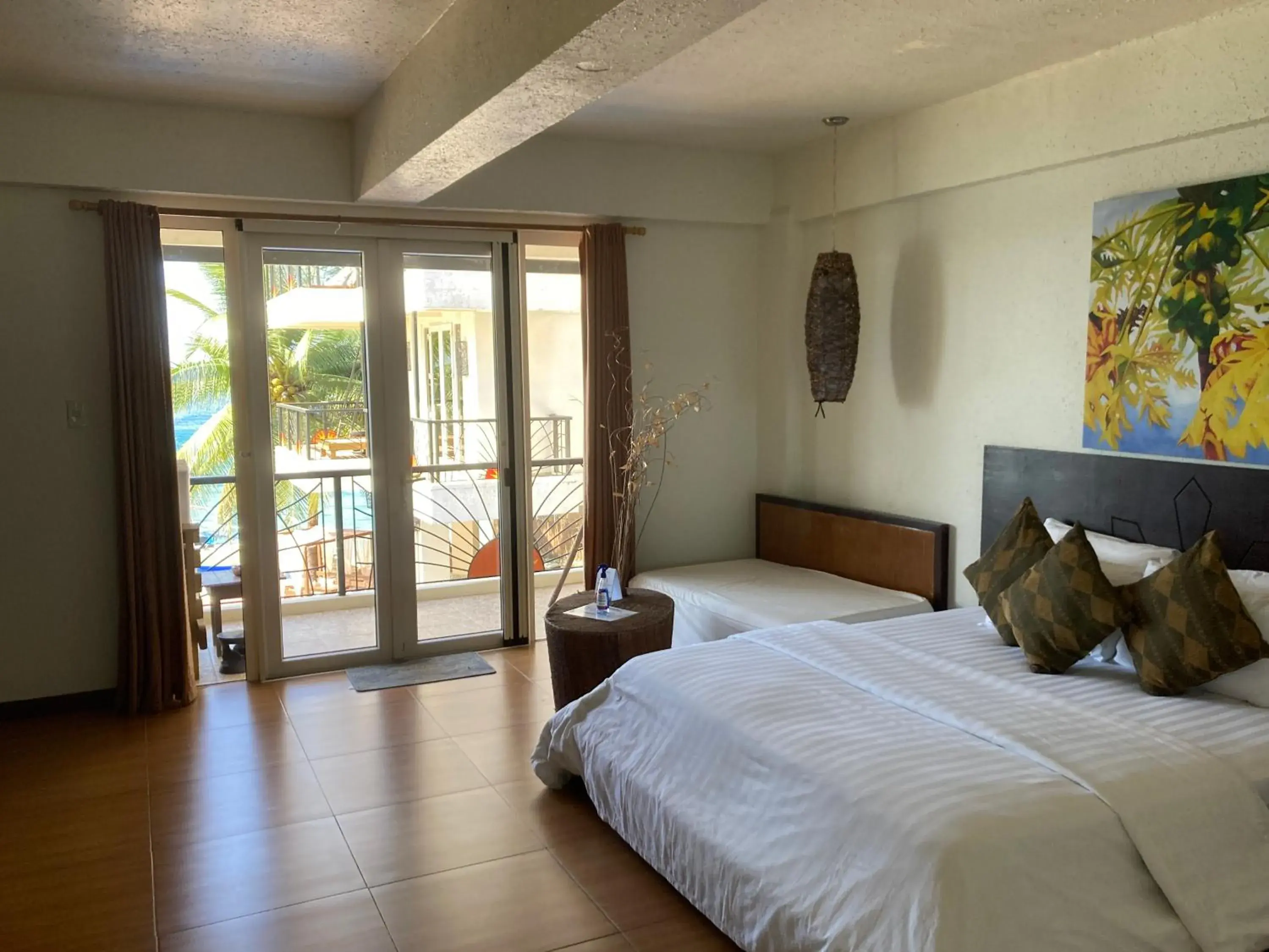 Photo of the whole room, Bed in Sunset At Aninuan Beach Resort