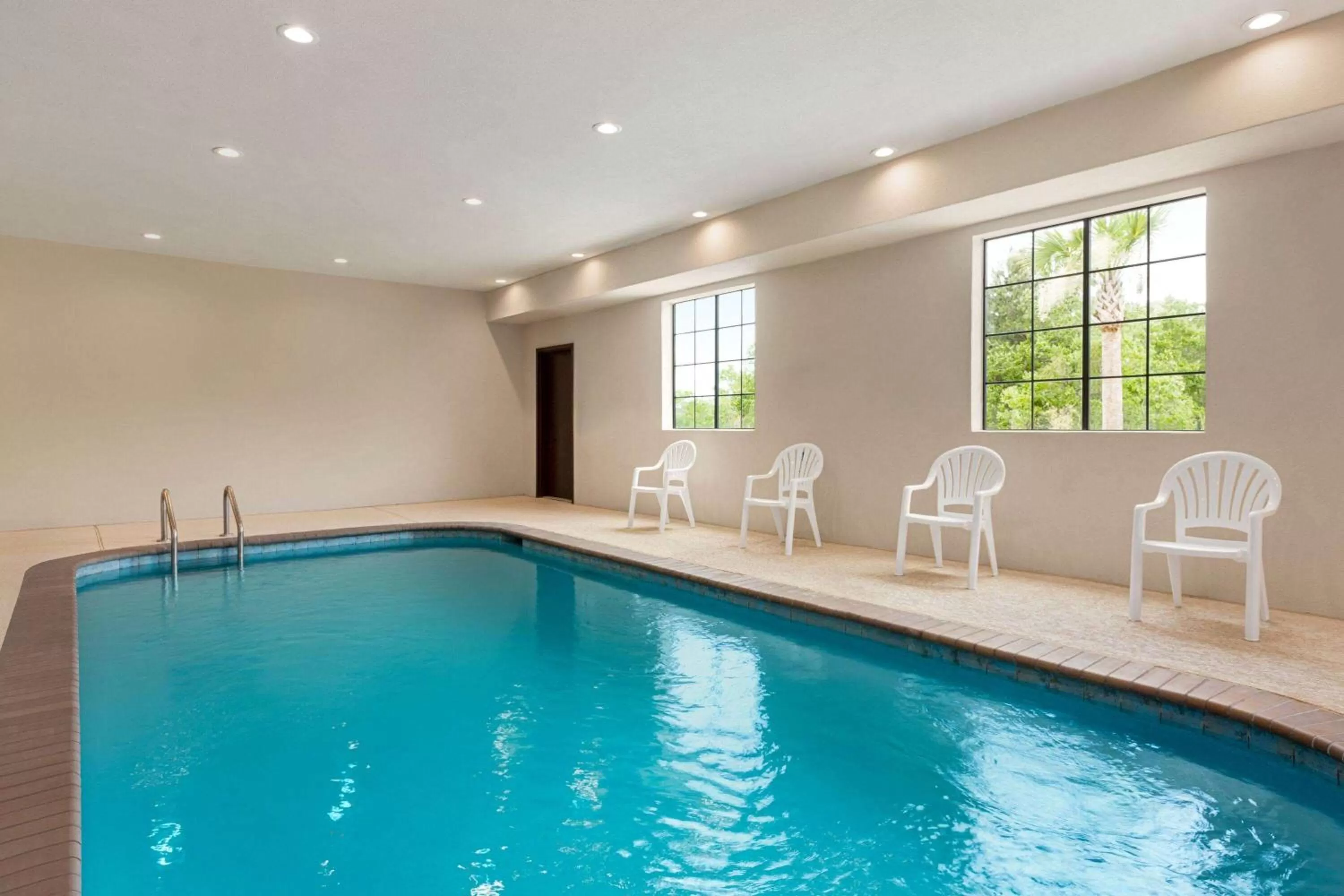 Swimming pool in Days Inn & Suites by Wyndham Greater Tomball
