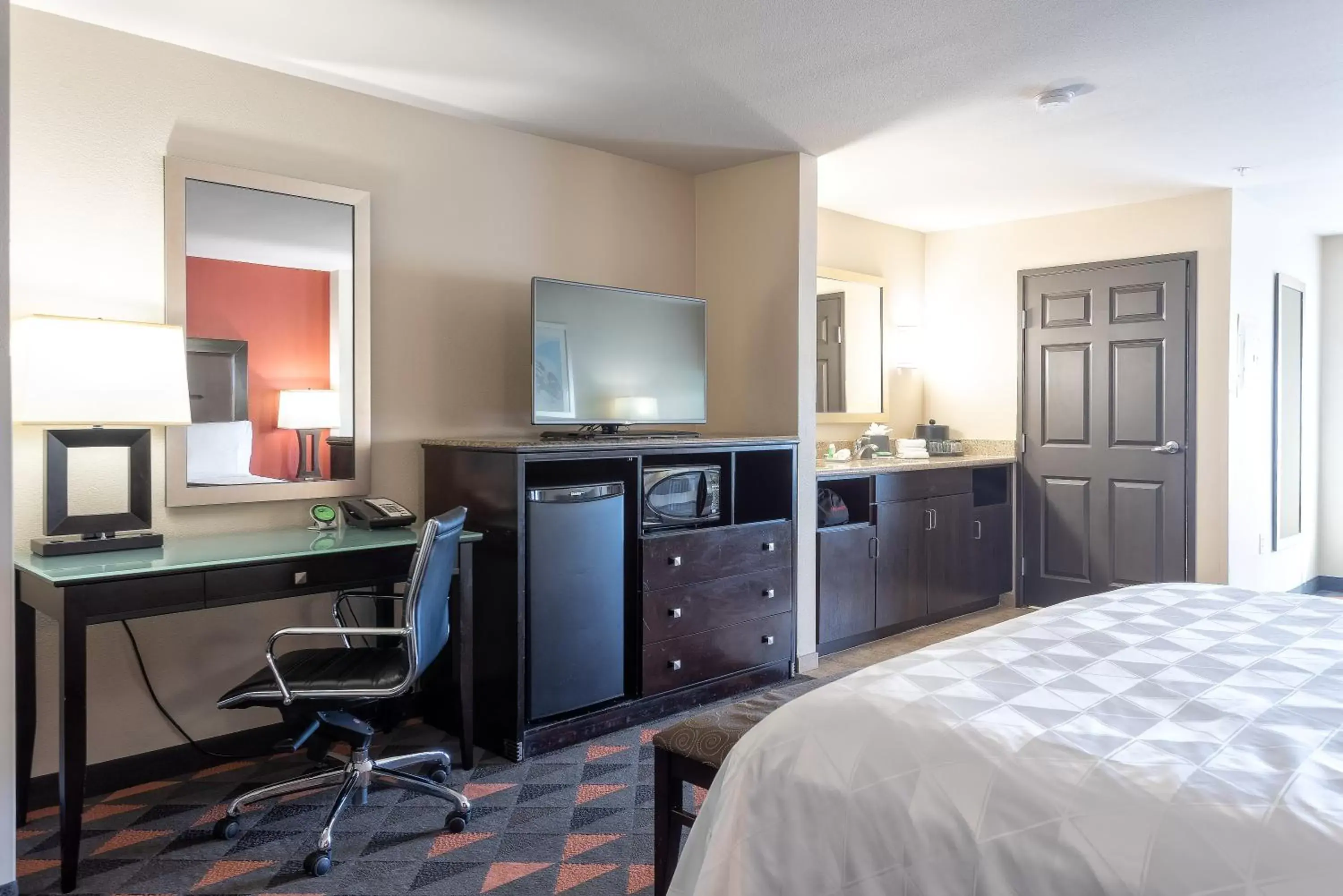 Photo of the whole room, TV/Entertainment Center in Holiday Inn Oceanside Marina Camp Pendleton, an IHG Hotel