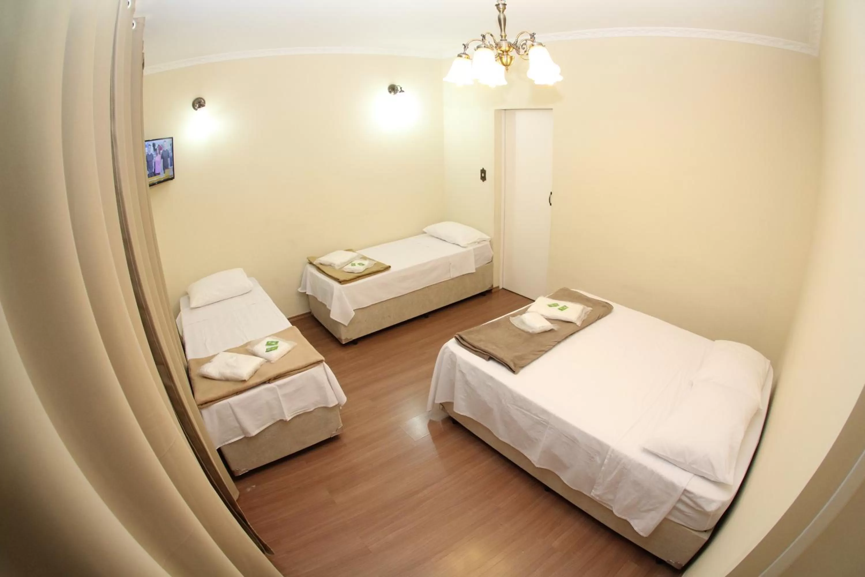 Bed in Pousada Santa Genebra