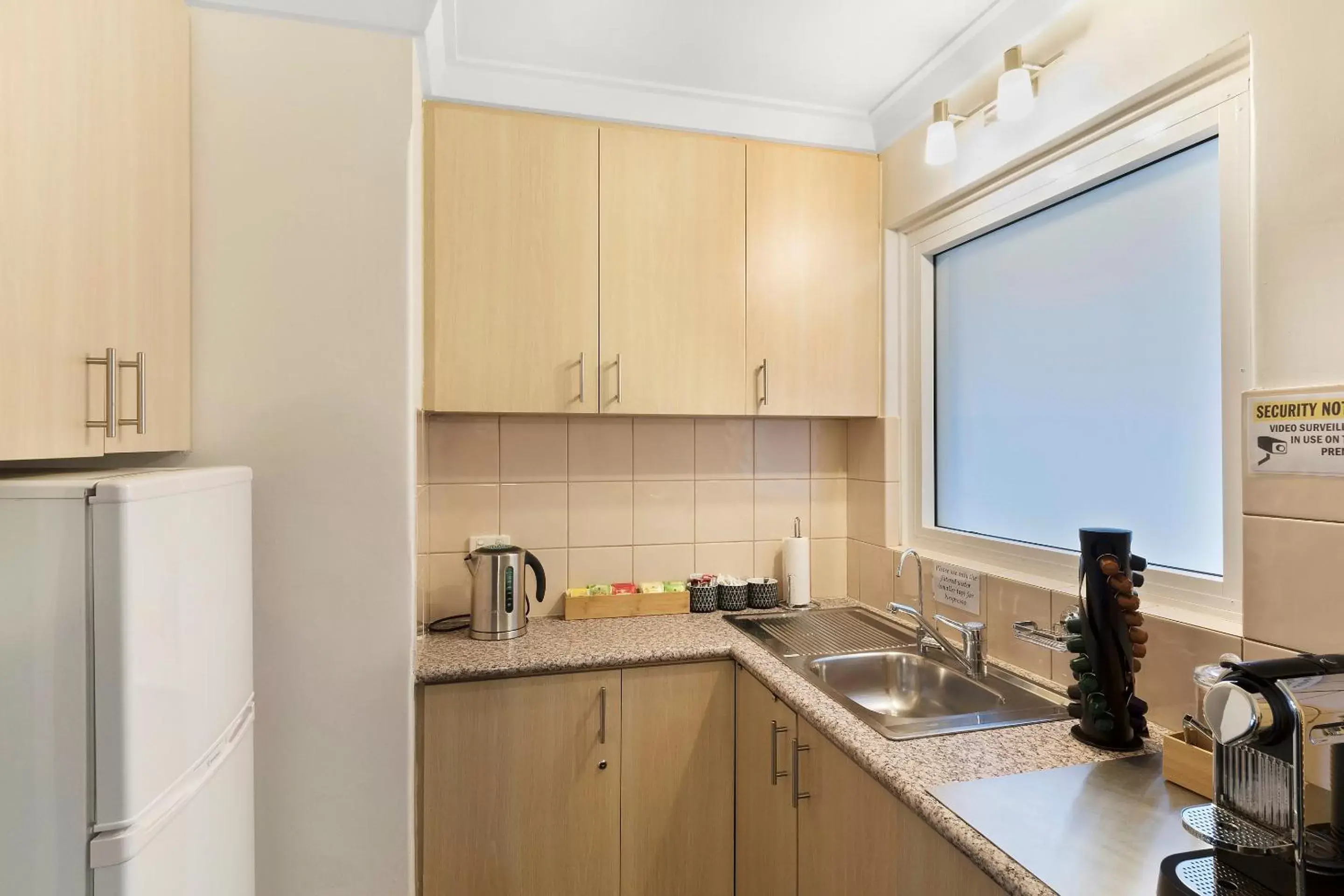 Bedroom, Kitchen/Kitchenette in The Peninsula Riverside Serviced Apartments