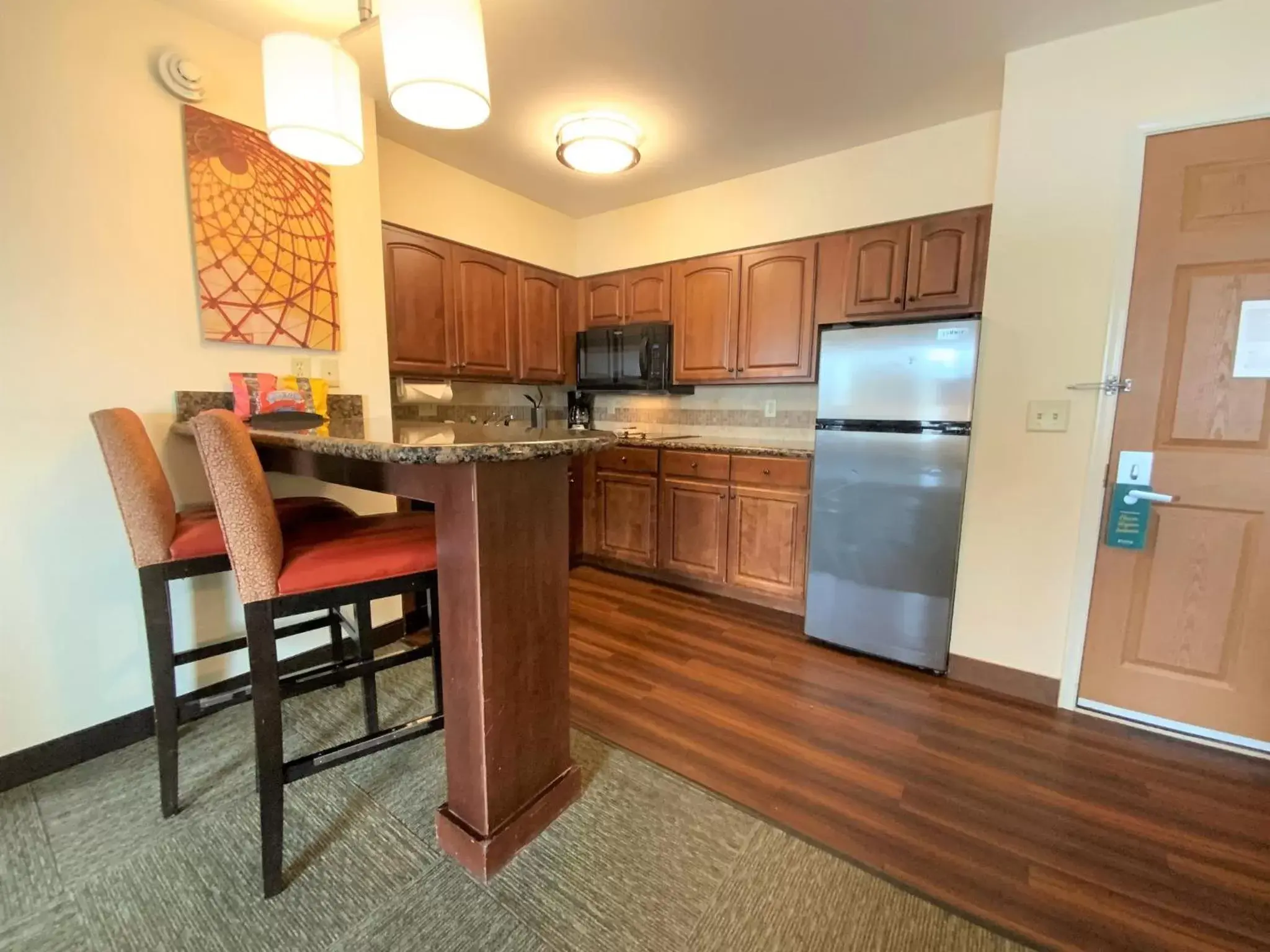 Bedroom, Kitchen/Kitchenette in Staybridge Suites Great Falls, an IHG Hotel