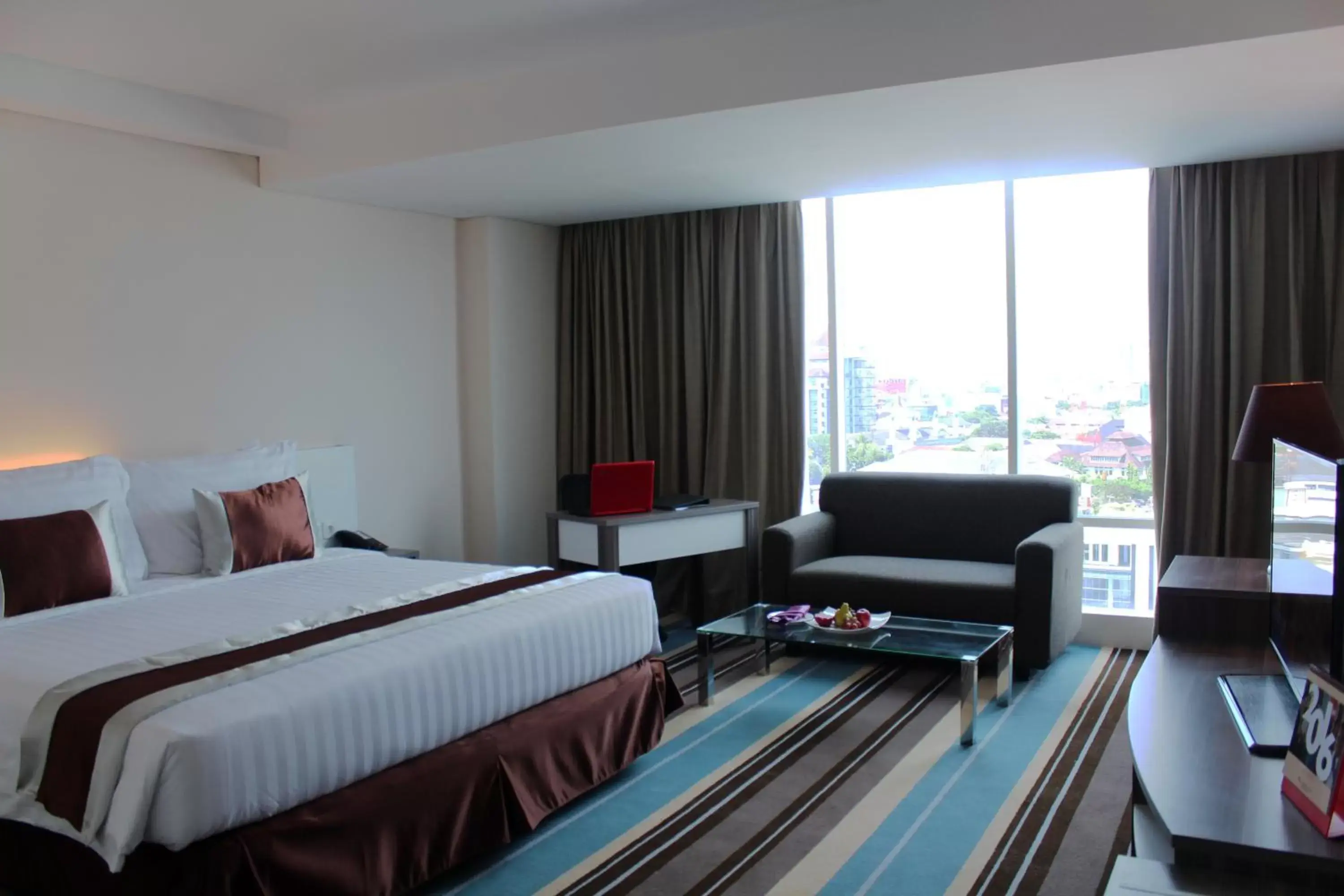 Bedroom in Swiss-Belhotel Makassar