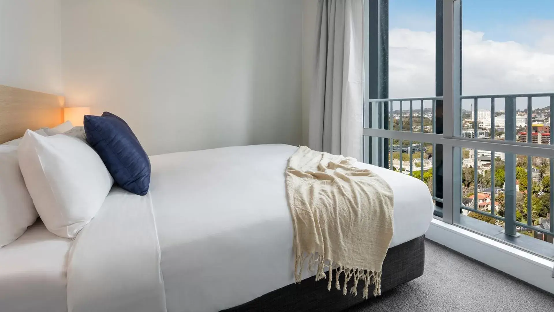 Bed in Auckland Harbour Suites