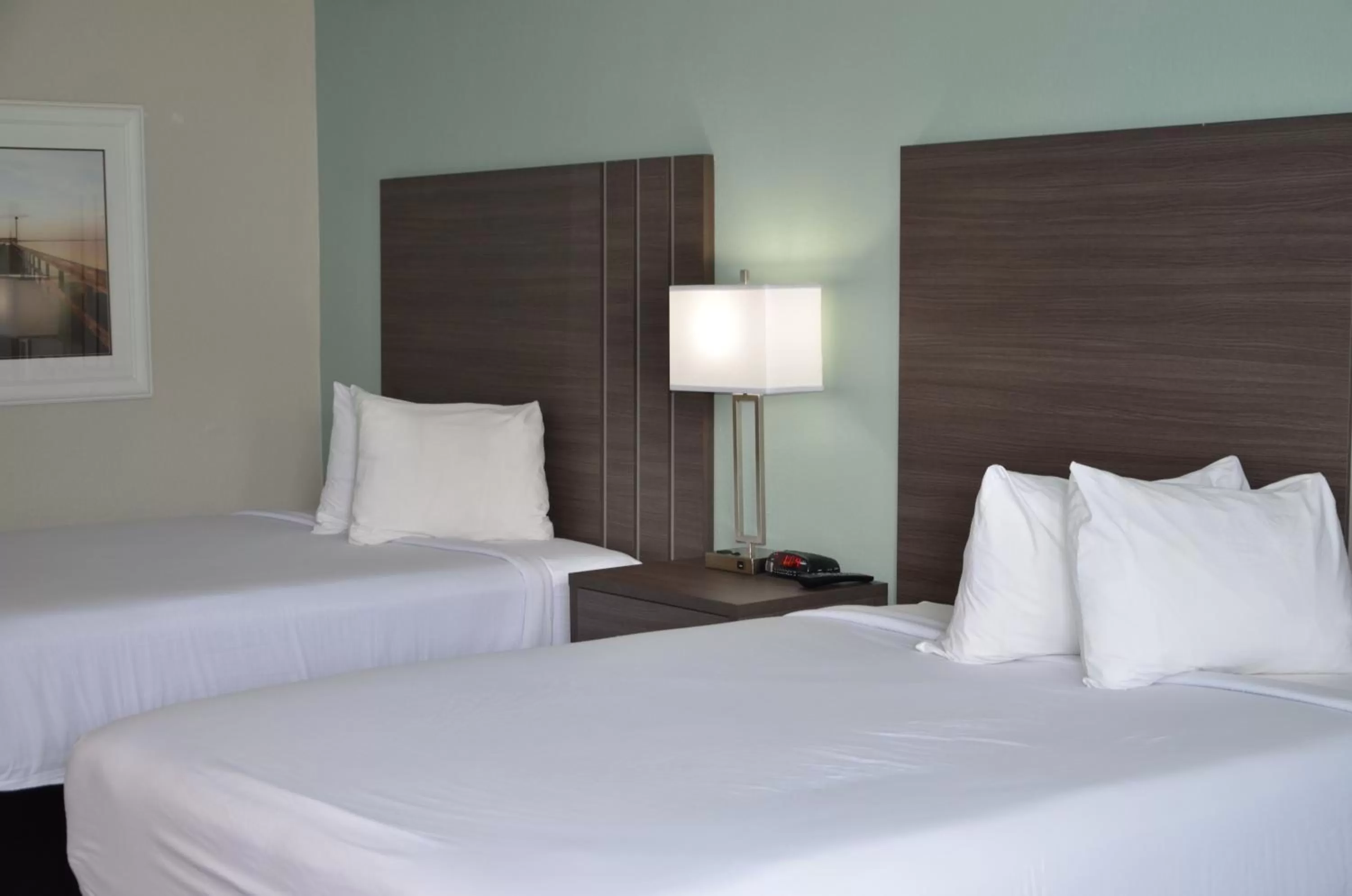 Bed in Opal Hotel & Suites