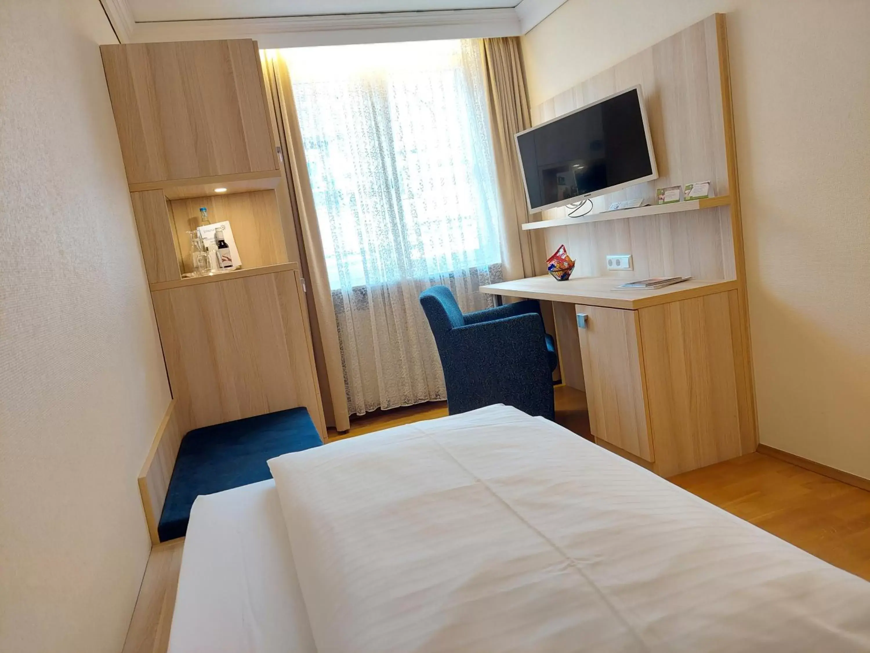 Bed, TV/Entertainment Center in Flair Hotel zum Schiff