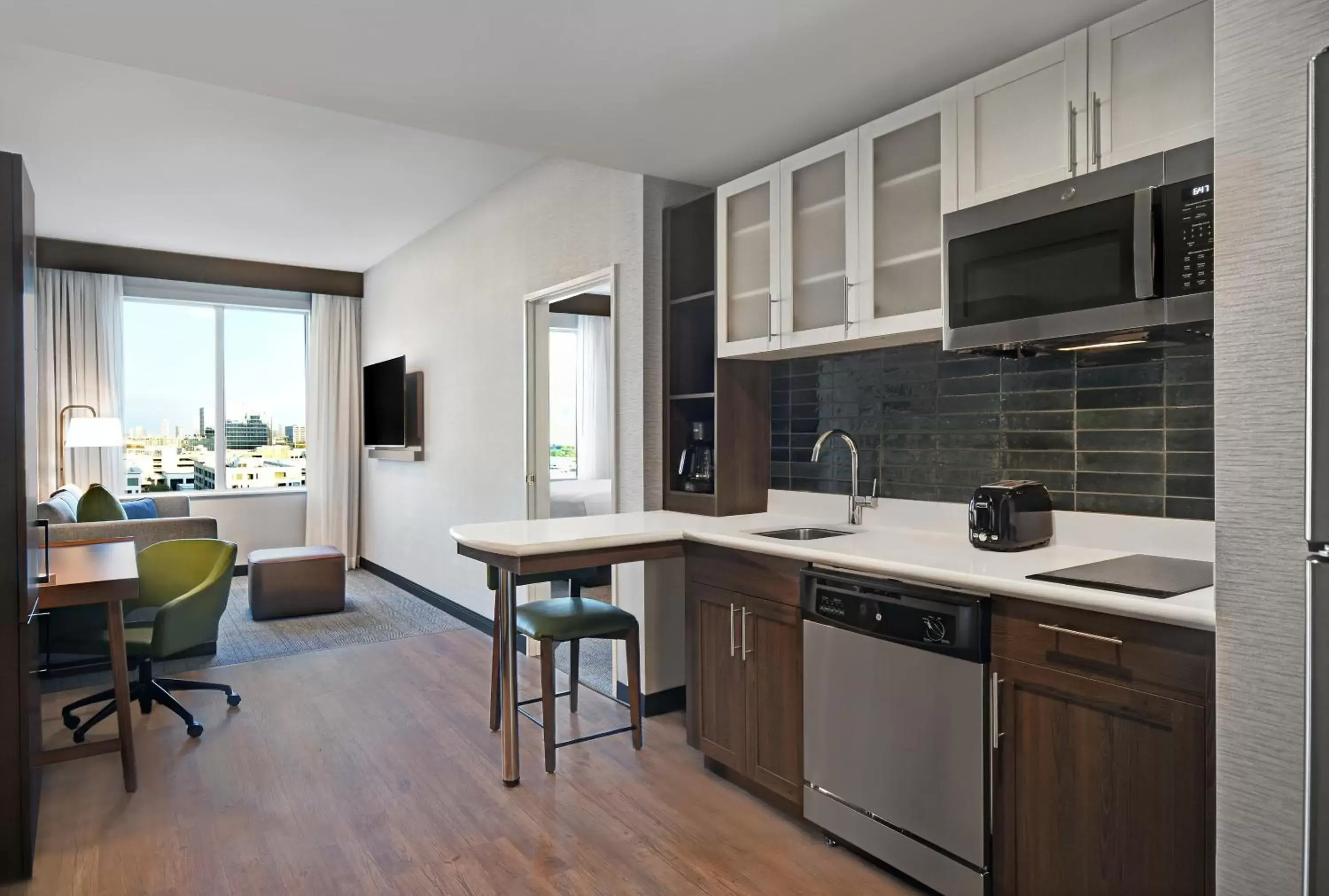 Bedroom, Kitchen/Kitchenette in Staybridge Suites - Houston - Galleria Area, an IHG Hotel