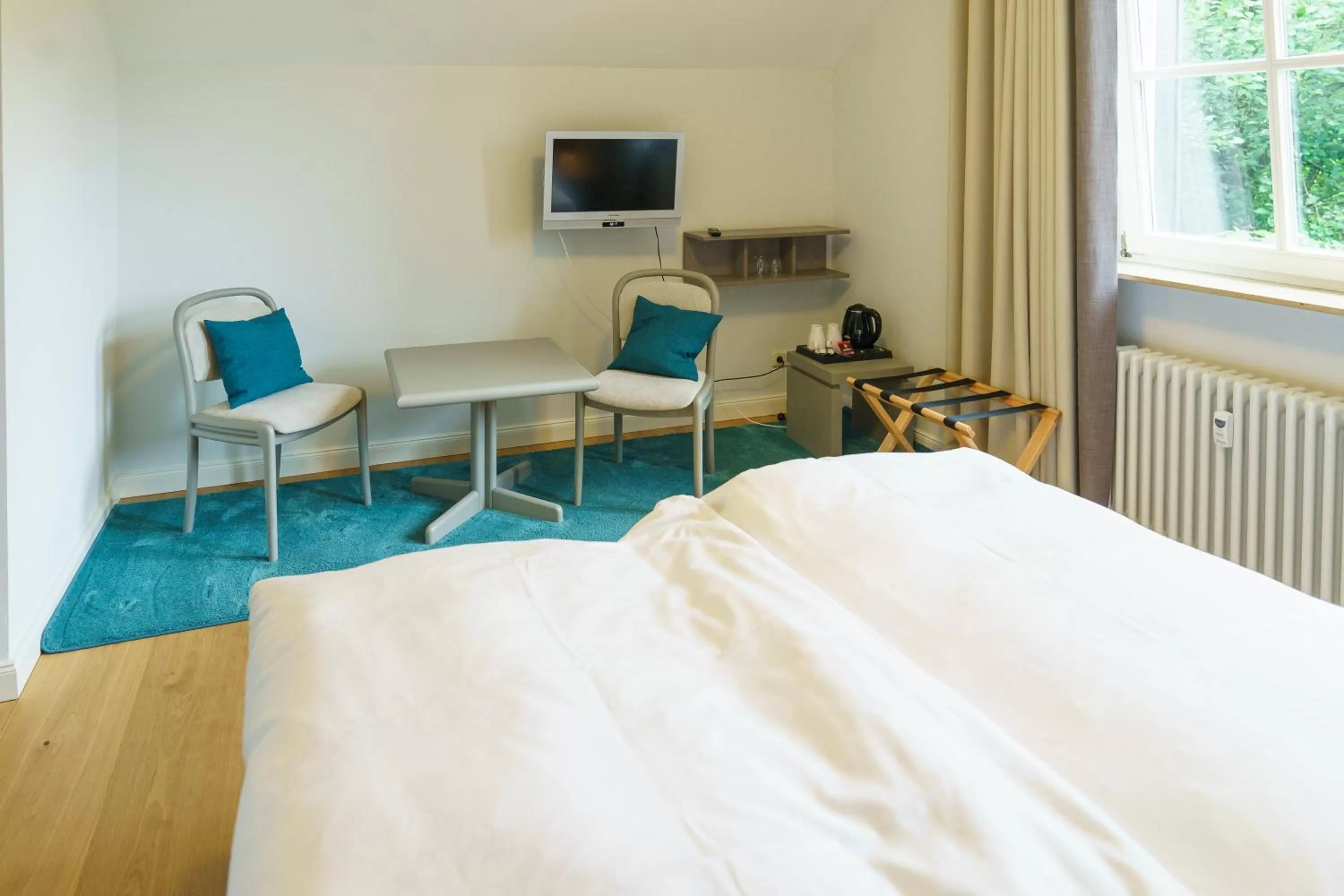 Seating area, Bed in Gästehaus Sonnenhof