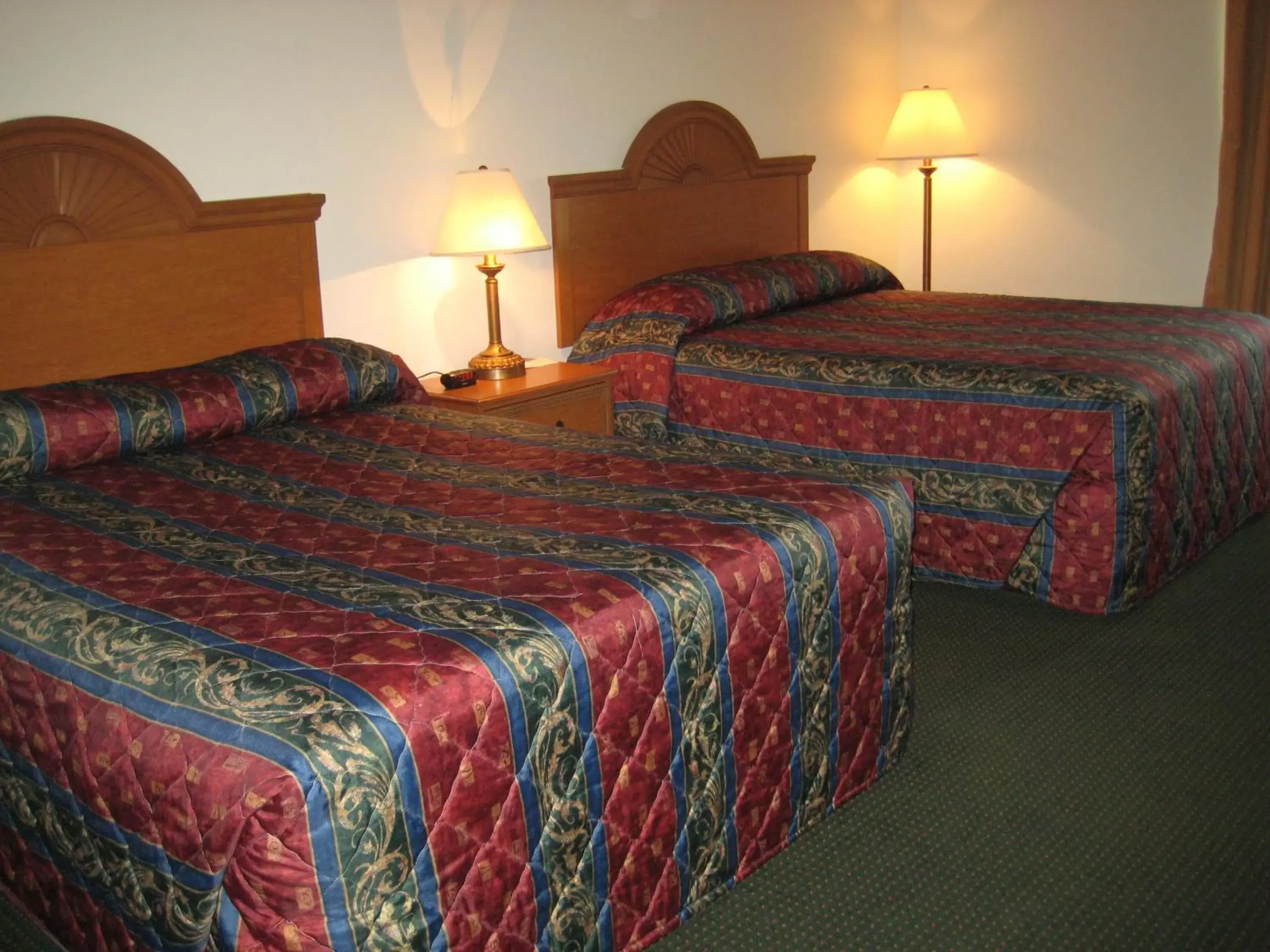 Bed in Horizon Inn & Suites