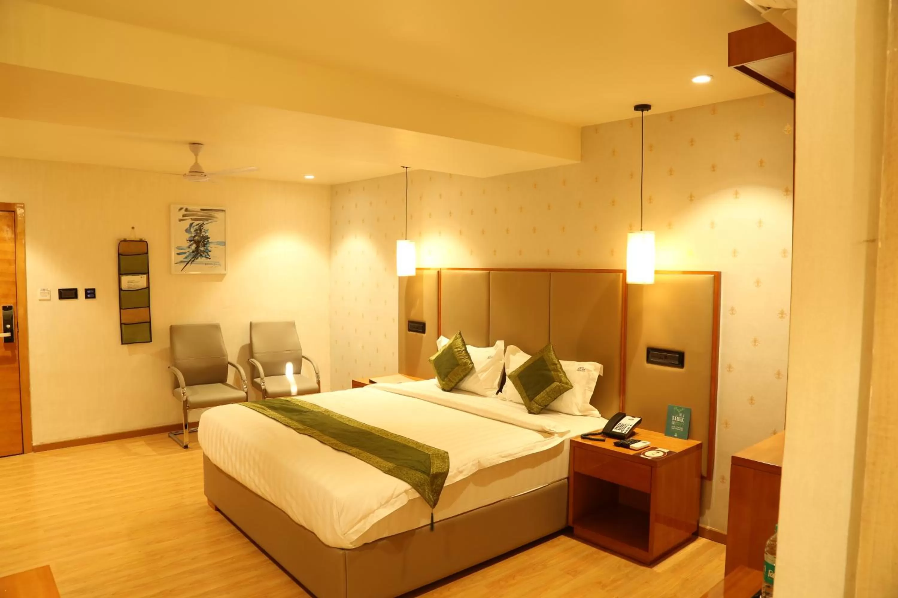 Bed in Hotel Reva Regency