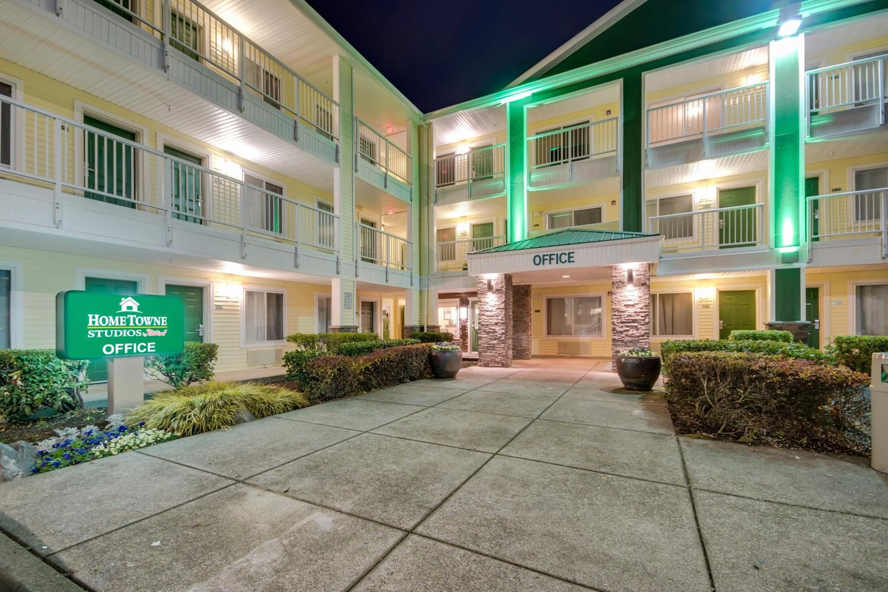 Property building in HomeTowne Studios by Red Roof Seattle - Kent/Des Moines