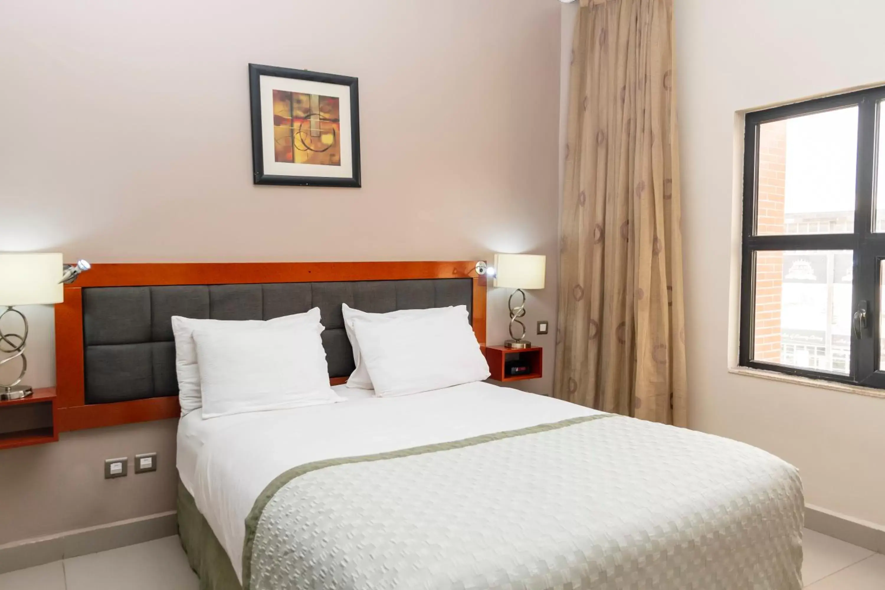 Bed in Hawthorn Suites by Wyndham Abuja