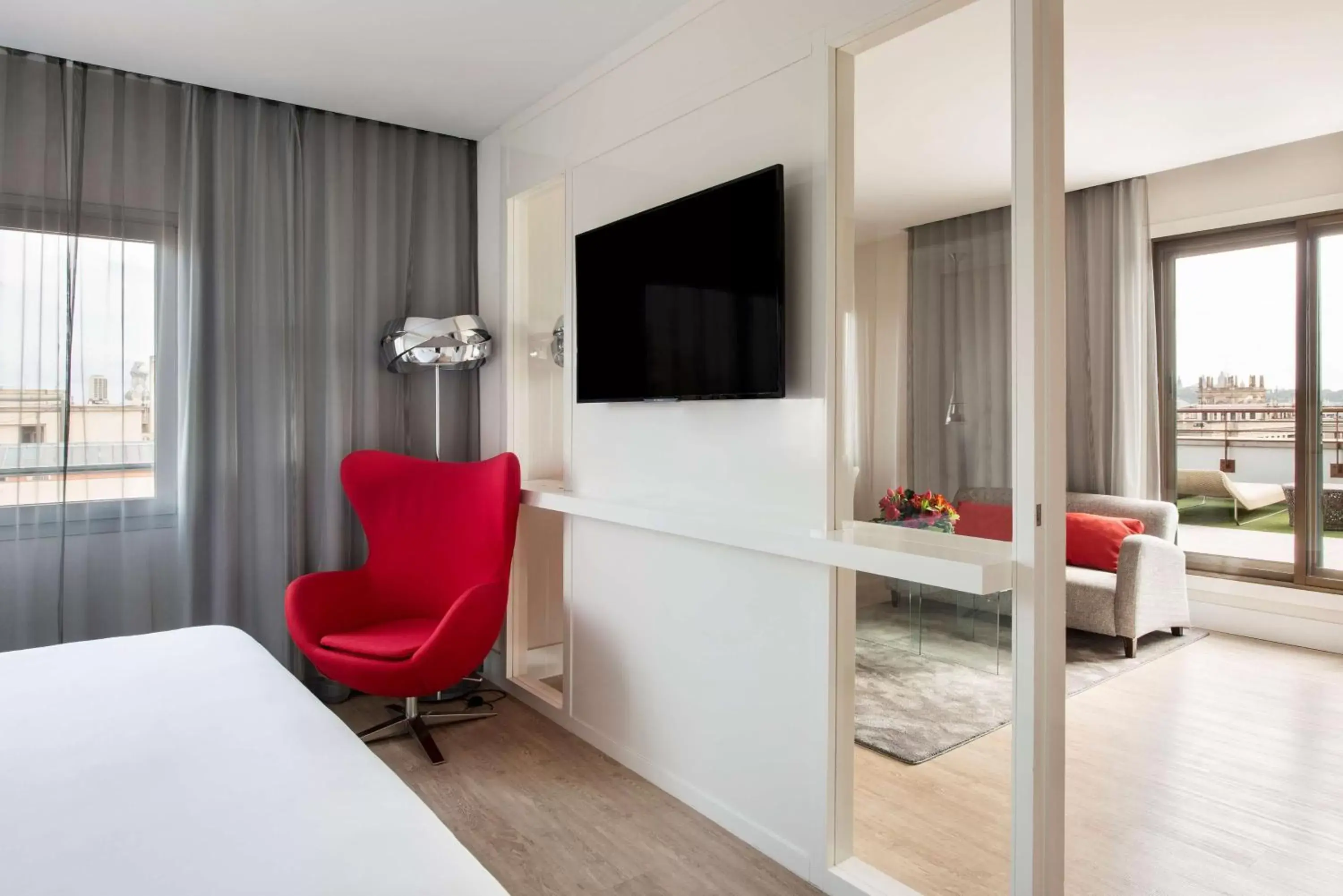 Photo of the whole room, TV/Entertainment Center in NH Collection Barcelona Gran Hotel Calderon