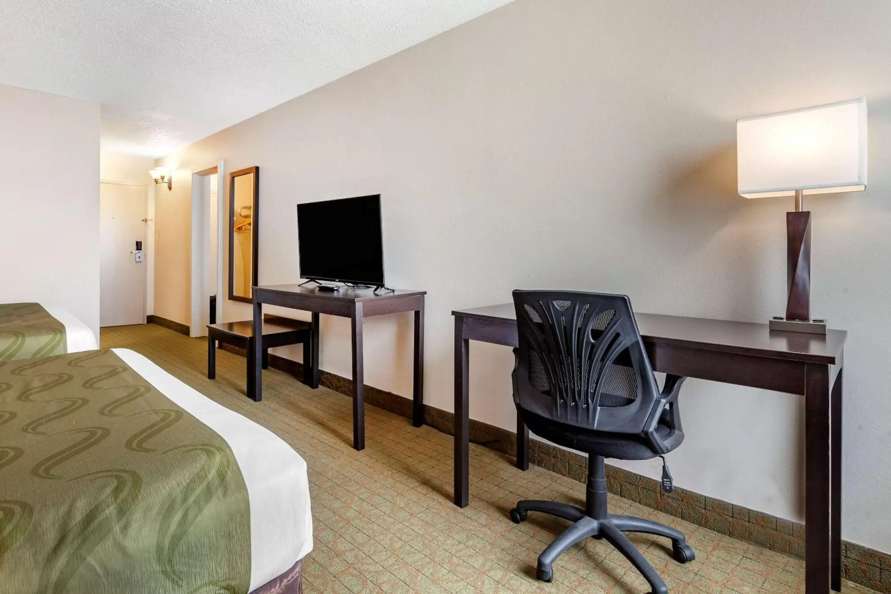 Photo of the whole room, TV/Entertainment Center in Quality Inn & Suites