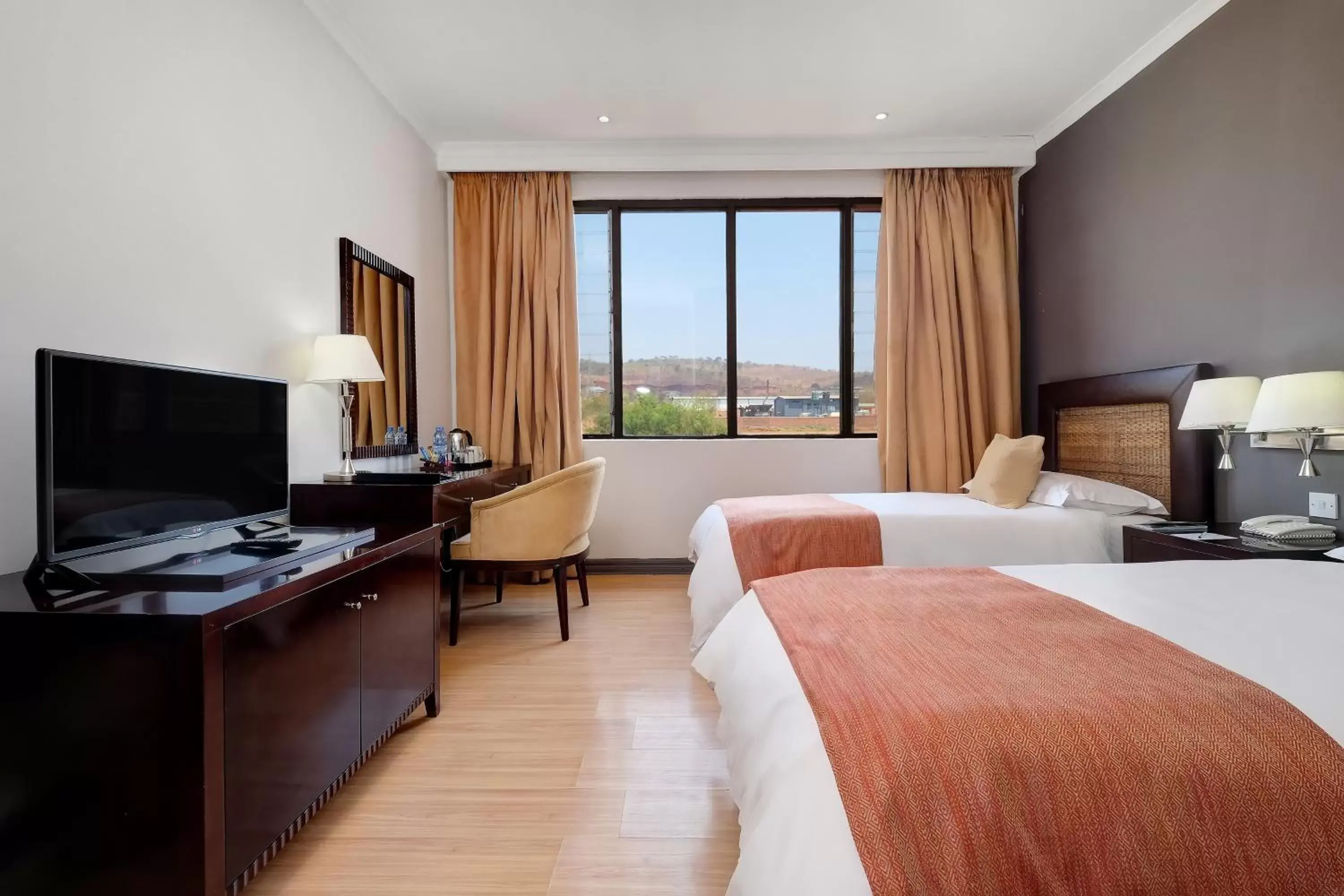 Bedroom, TV/Entertainment Center in Protea Hotel by Marriott Chipata