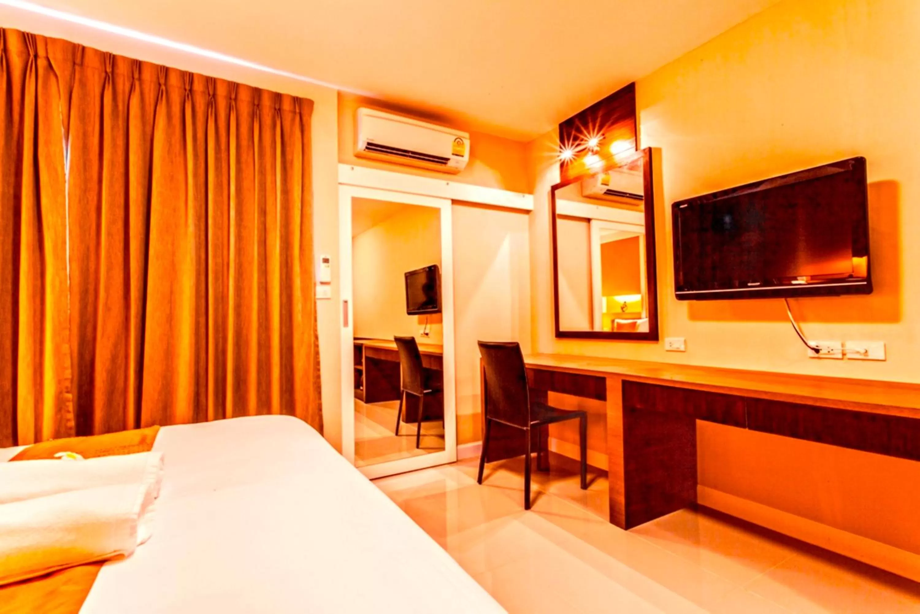 Photo of the whole room, Bed in The Aim Sathorn Hotel