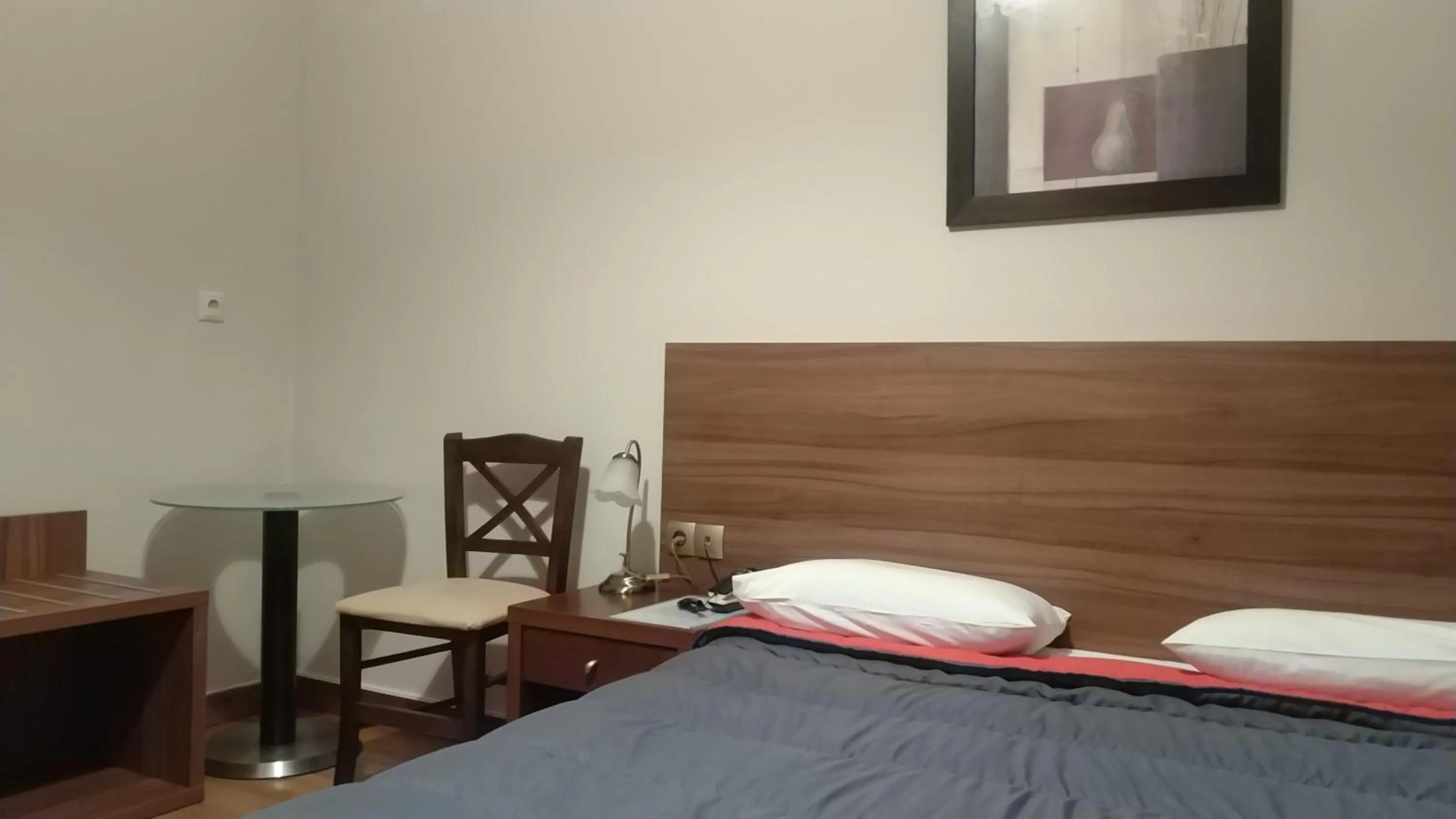 Bed in Ambrosia Suites