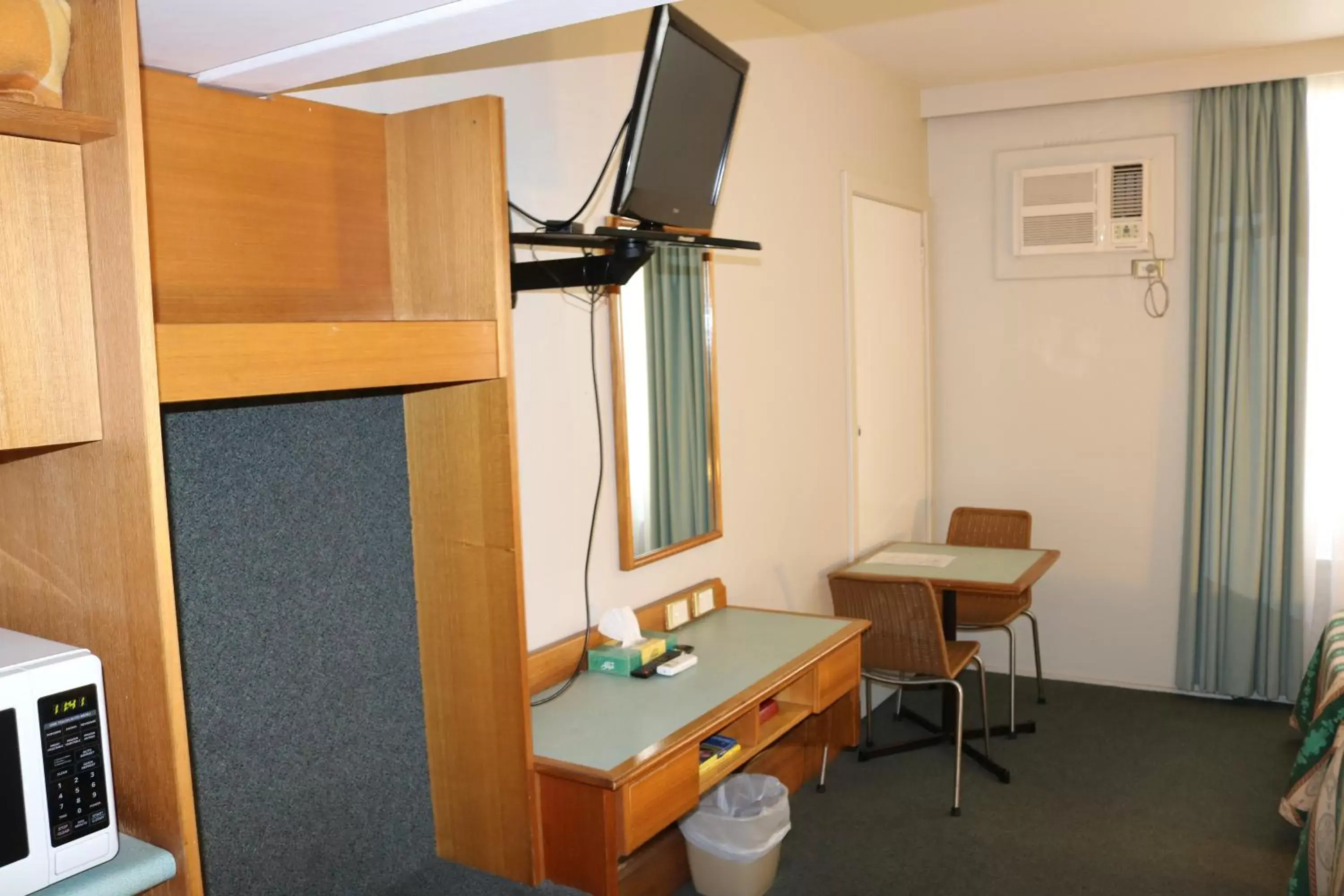 Photo of the whole room, TV/Entertainment Center in Hermitage Motel