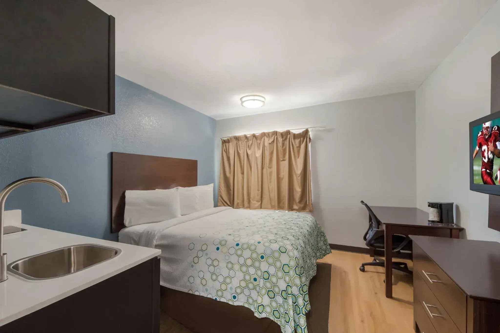 Bedroom, Bed in HomeTowne Studios by Red Roof San Antonio - SeaWorld Northwest