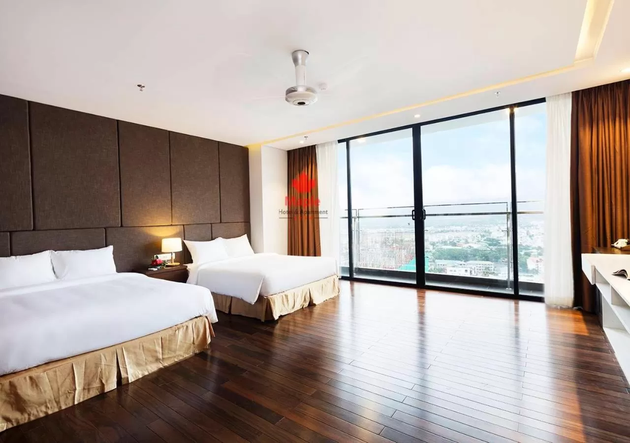 Bed in Maple Hotel & Apartment