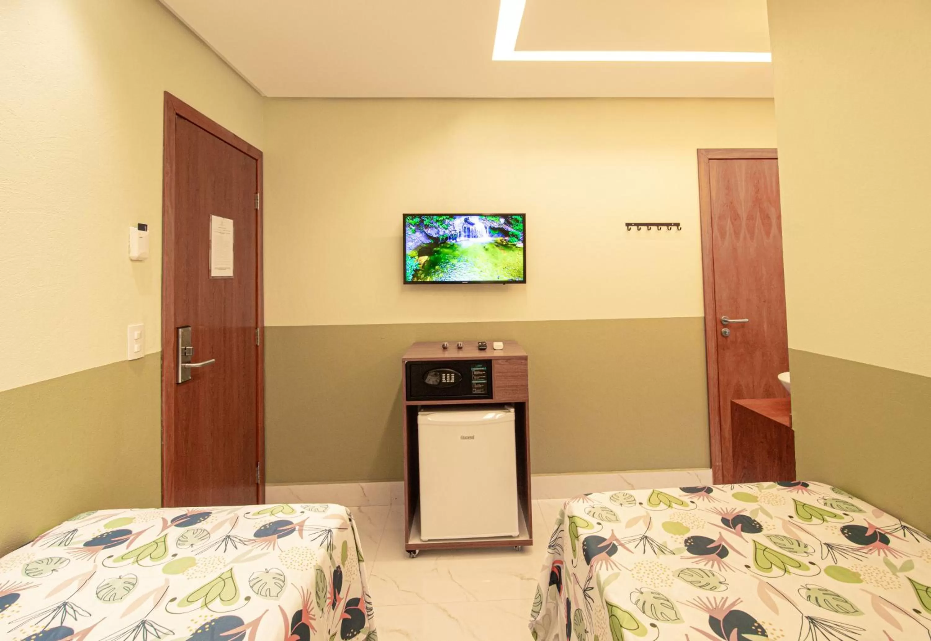 TV and multimedia, Bed in Pousada Flores do Carmo