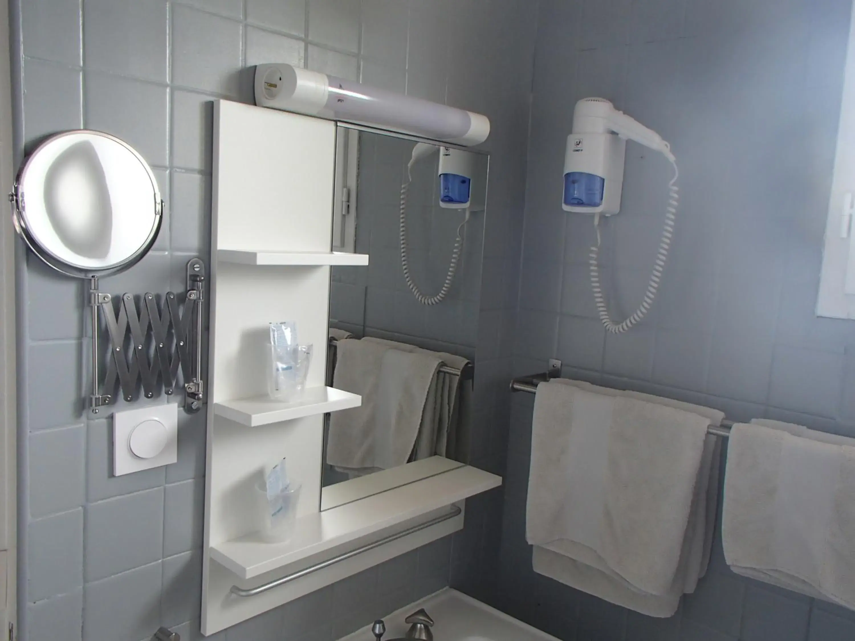 Bathroom in Logis Hotel le Pont d'Arcole