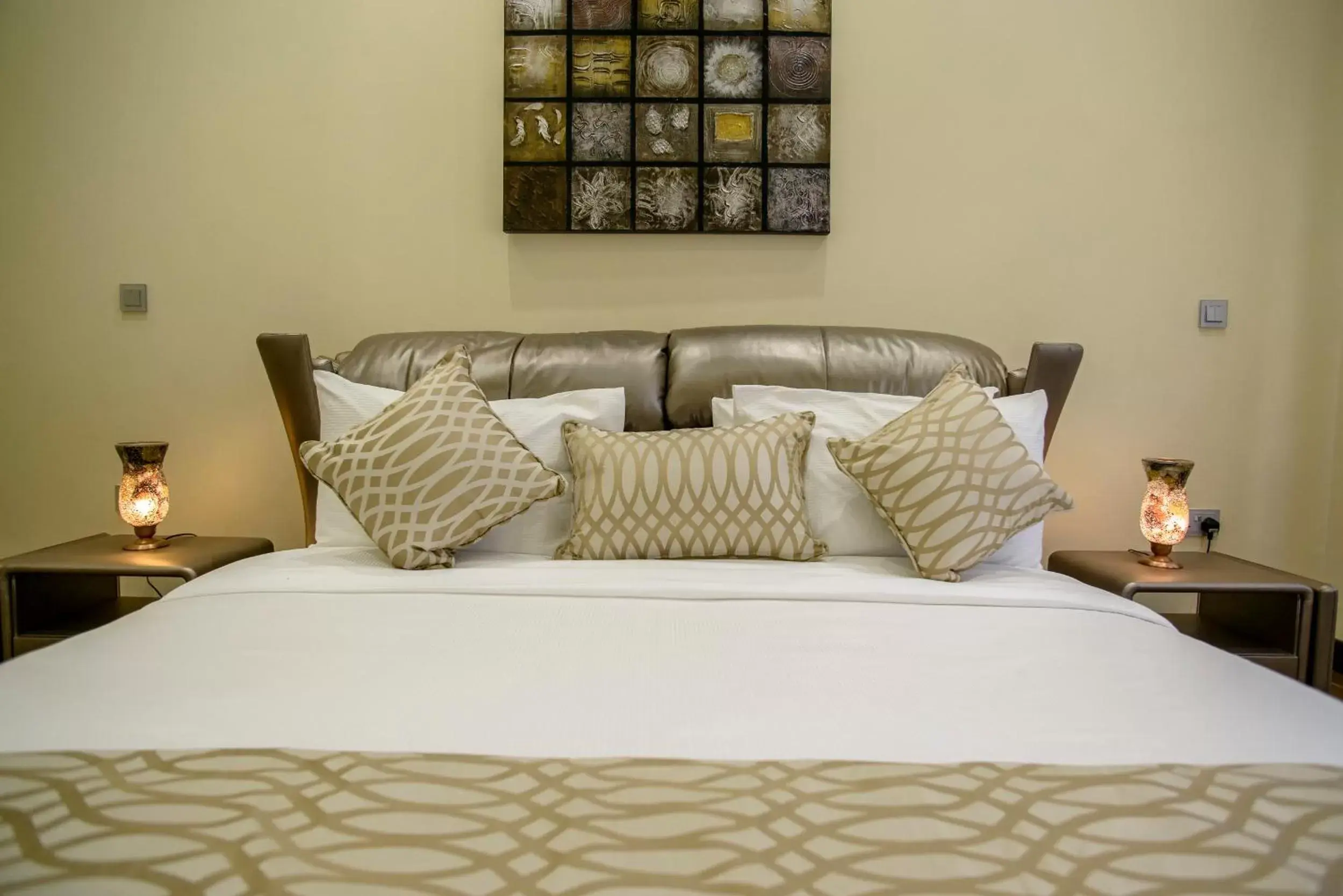 Bed in The Landmark Suites