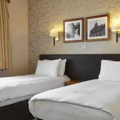 Bed in Ye Olde Talbot Hotel by Greene King Inns