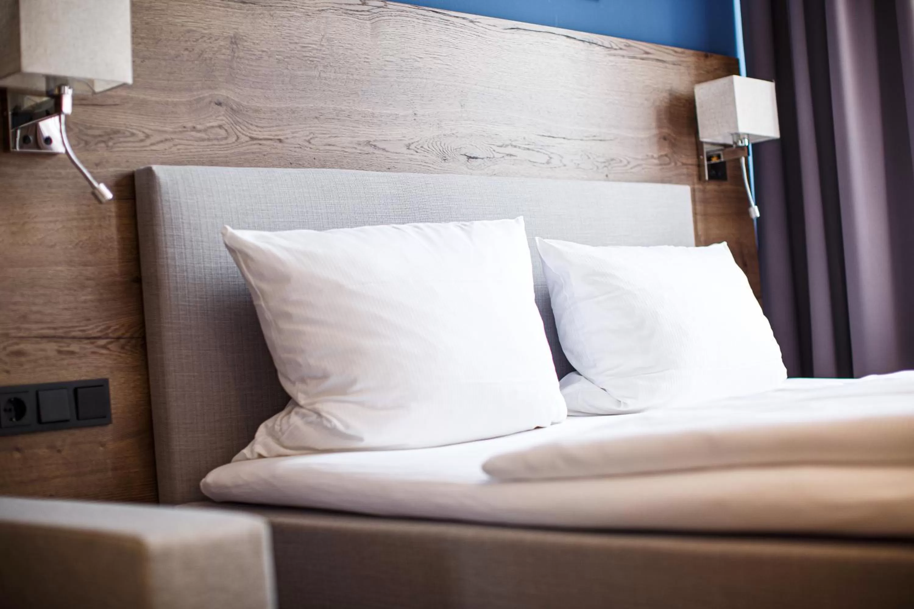 Bed in Romantik Hotel Aquarium