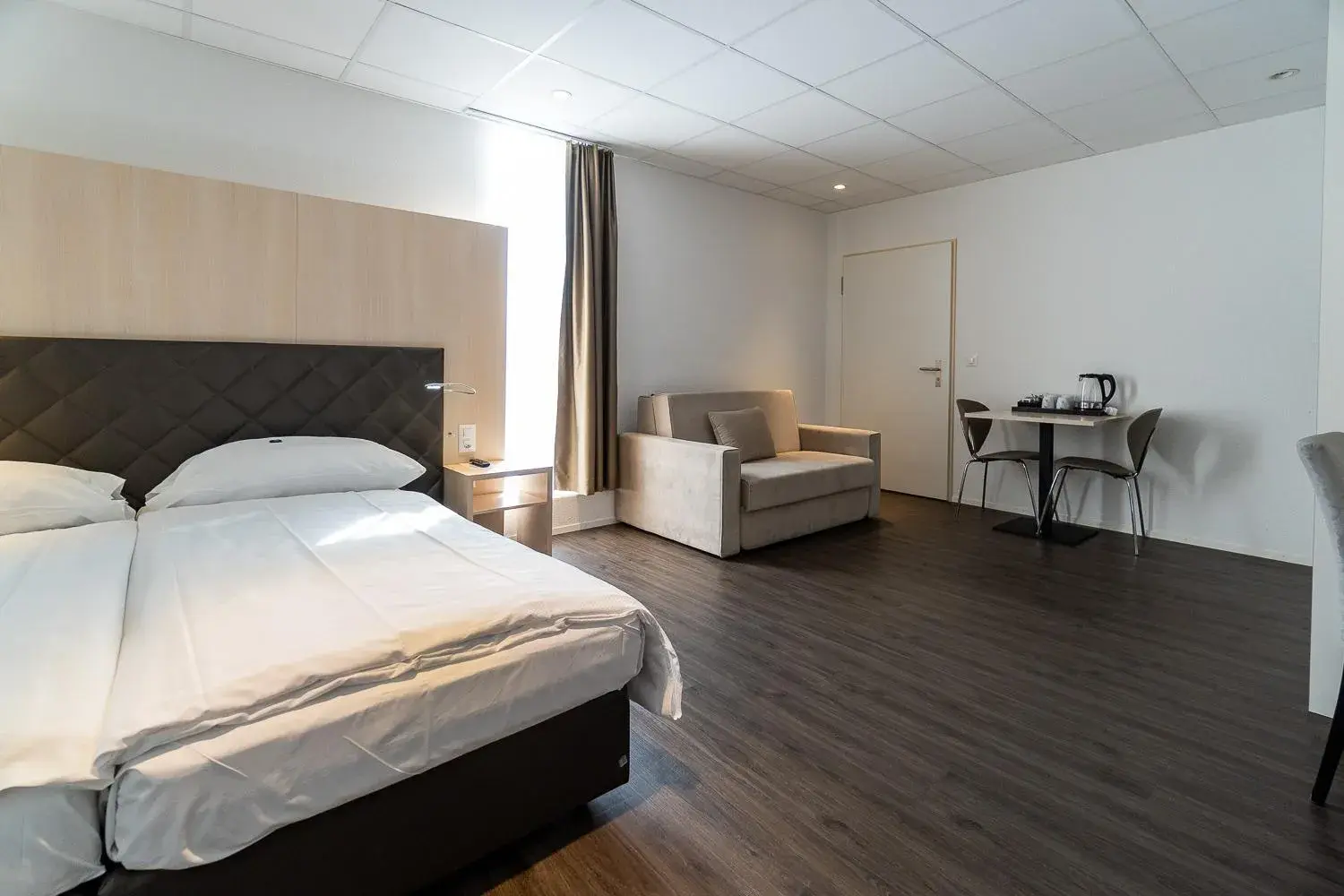 Photo of the whole room in Hotel Hine Adon Bern Airport